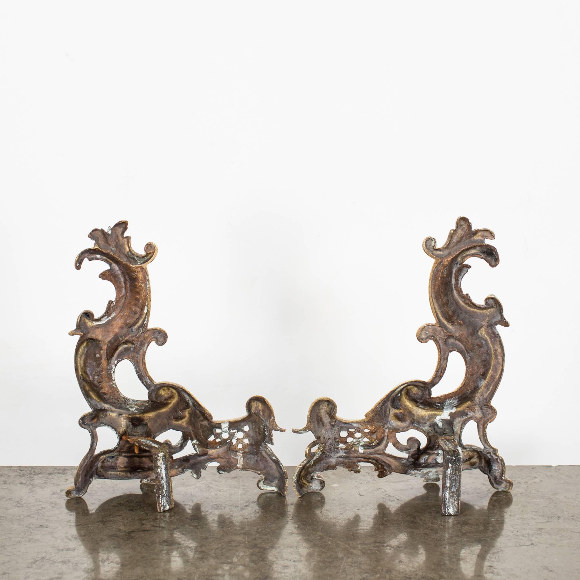 A pair of bookstands made in a Rococo style in Europe. Made of brass and shaped in C-curves and acanthus leaves.