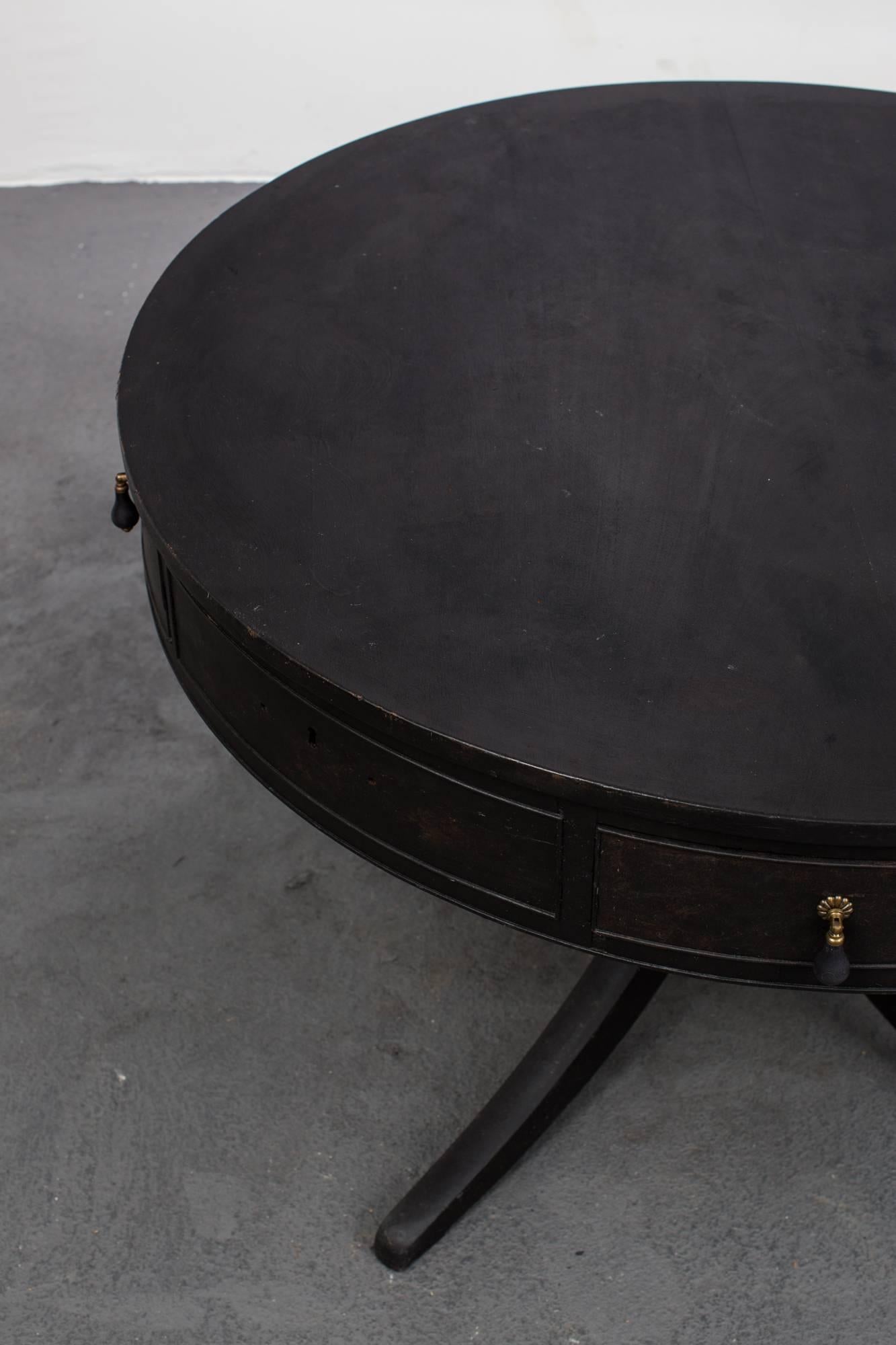 Table Centre Swedish Black 19th Century Sweden. A centre table made during the 19th century in Sweden. Drawers along the curved frieze. Round top on a four legged base. Repainted in our Laserow Black with contemporary hardware. 

  