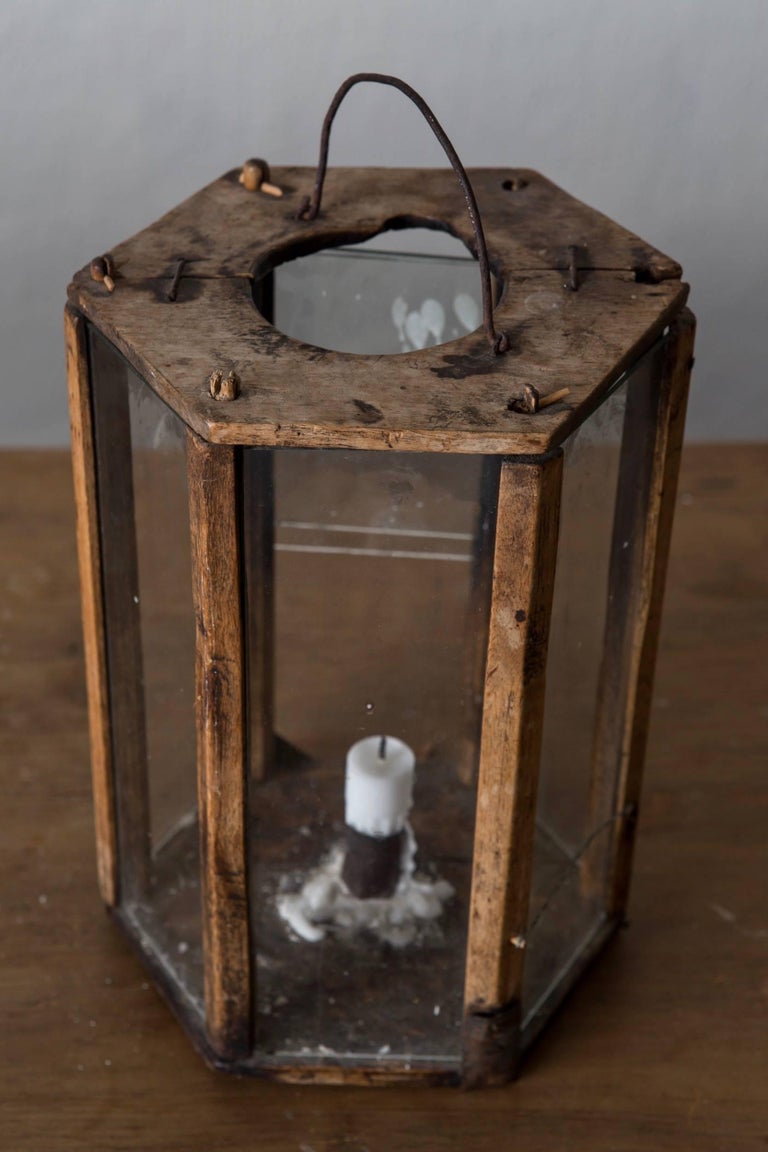 Lantern wood, Swedish, 19th century Sweden. A lantern made in Sweden during the early 19th century. Frame in wood with original glass. One candle holder.