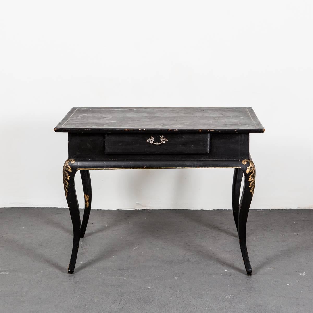 A black painted Rococo side table from the Rococo period 1750-1775. Painting made during the 19th century in black with gilded acanthus leaves. Curved legs with and beveled frieze. Drawer in frieze.