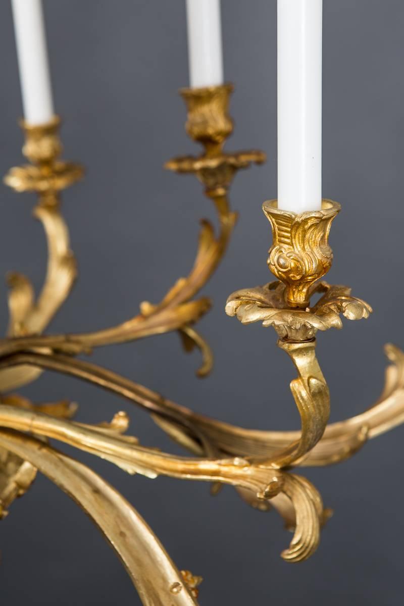 Chandelier French large brass 19th century, France. A chandelier made during the 19th century in France. Eleven arms for candles. Can be wired for electricity.