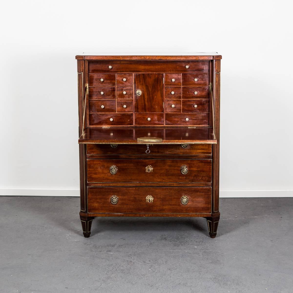 Secretary Swedish Gustavian mahogany, Sweden. A beautiful secretary made in Sweden during the Gustavian period 1775-1810 in mahogany. Details and hardware in brass. Interior with several compartments and drawers. Tapered and channeled legs.