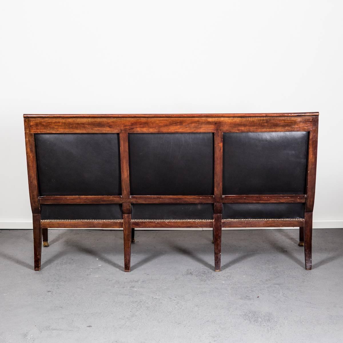 Sofa Bench French Empire Period 1790-1810 Mahogany Black Leather France. A gorgeous sofa made in France during the Empire period, circa 17900-1810. Mahogany frame with gilded brass decor shaped as palm leaves. Tapered legs ending with lion feet