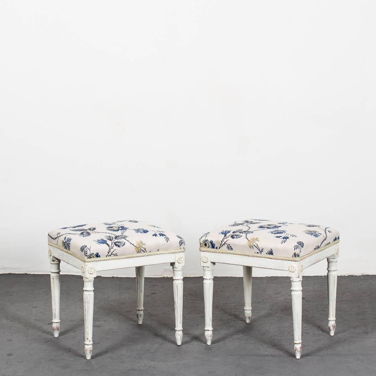 A pair of Swedish Gustavian white painted stools