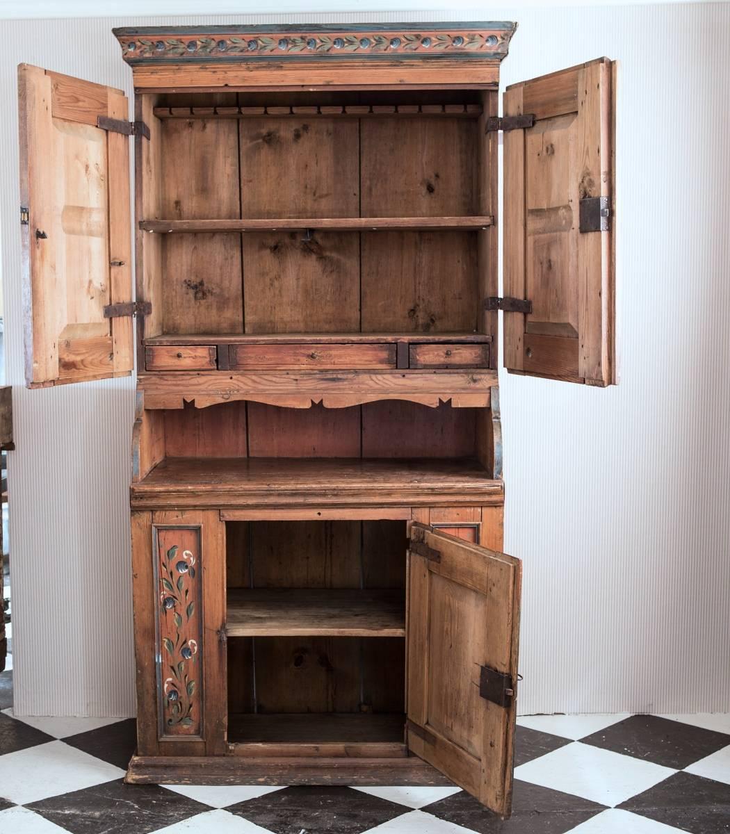 A beautiful cabinet made in Sweden during the 19th century in Allmoge. Shelving interior upper and lower cabinet. 

 