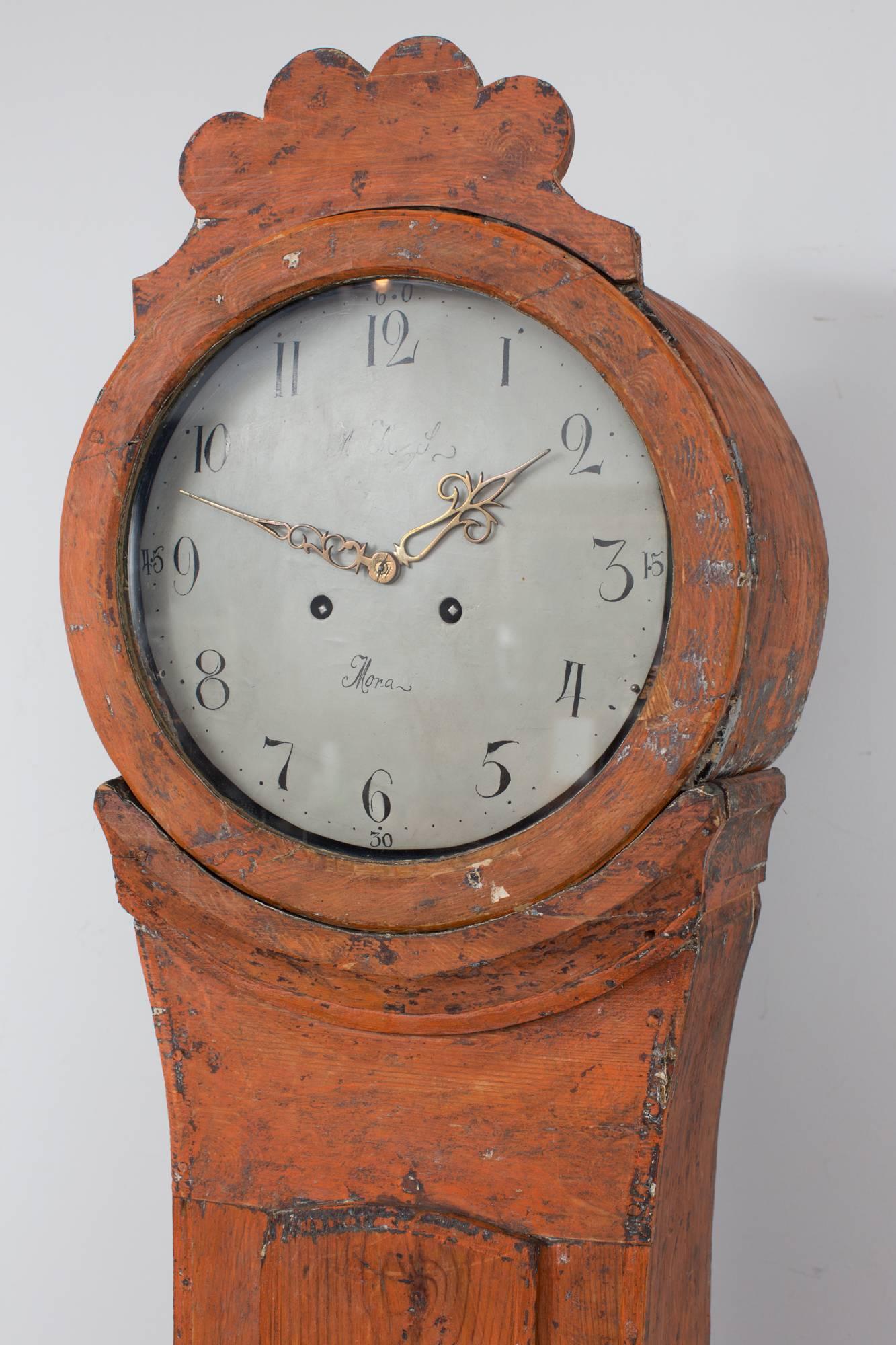 A floor clock made during the 19th century in Mora, Sweden. Original orange paint.