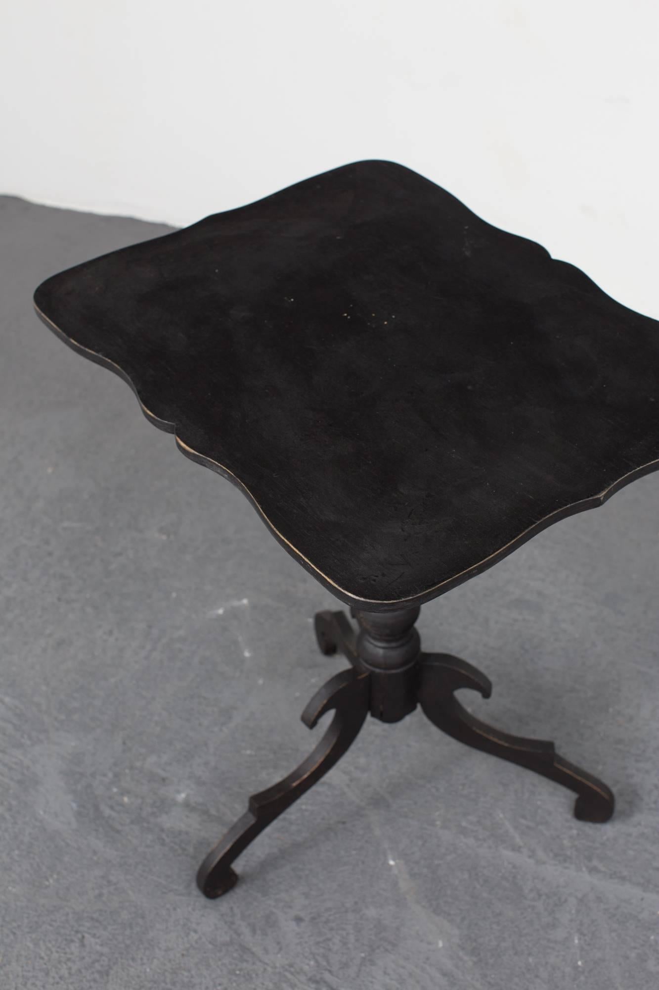 A side table or pedestal table black, made during the end of 19th century in Sweden. Painted in our custom paint 