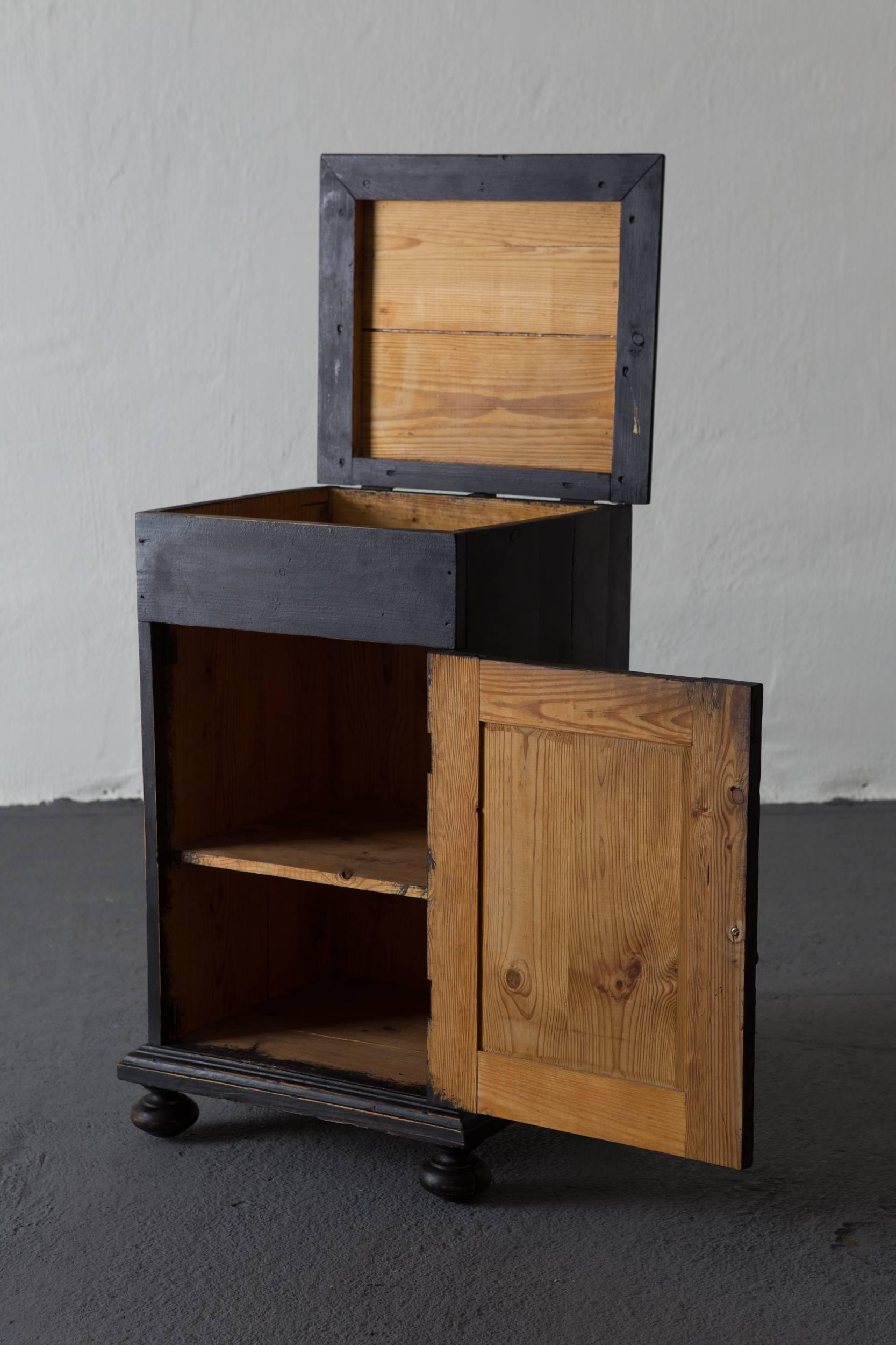 Nightstand, Swedish, 19th century. A small cupboard made in Sweden during the 19th century, circa 1880. Painted in our Laserow black. New hardware. Interior with a shelf.