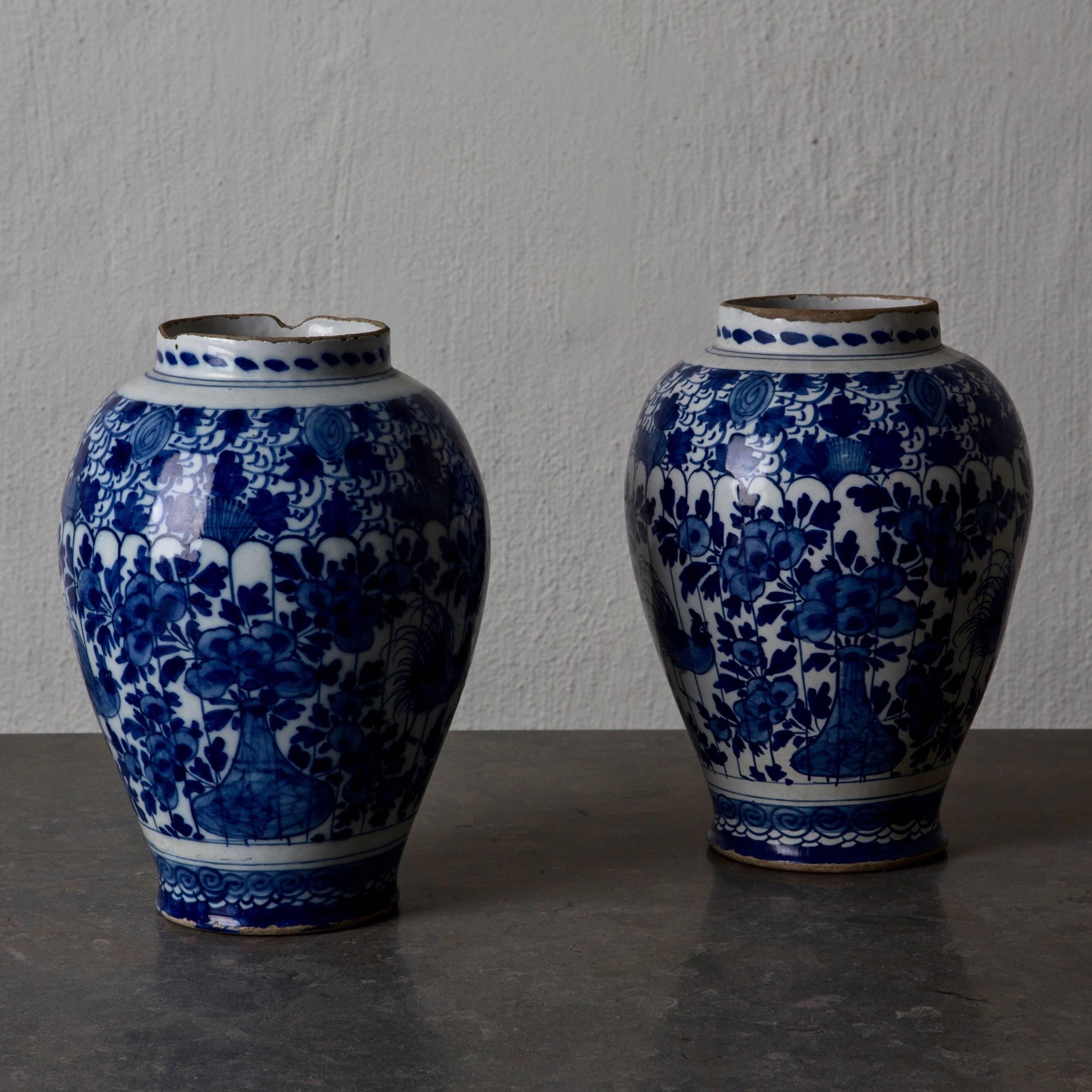 Urns pair of delft blue and white 18th century, Holland. A pair of stunning urns made during the 18th century in Delft, Holland. Glazed pottery in blue and white.