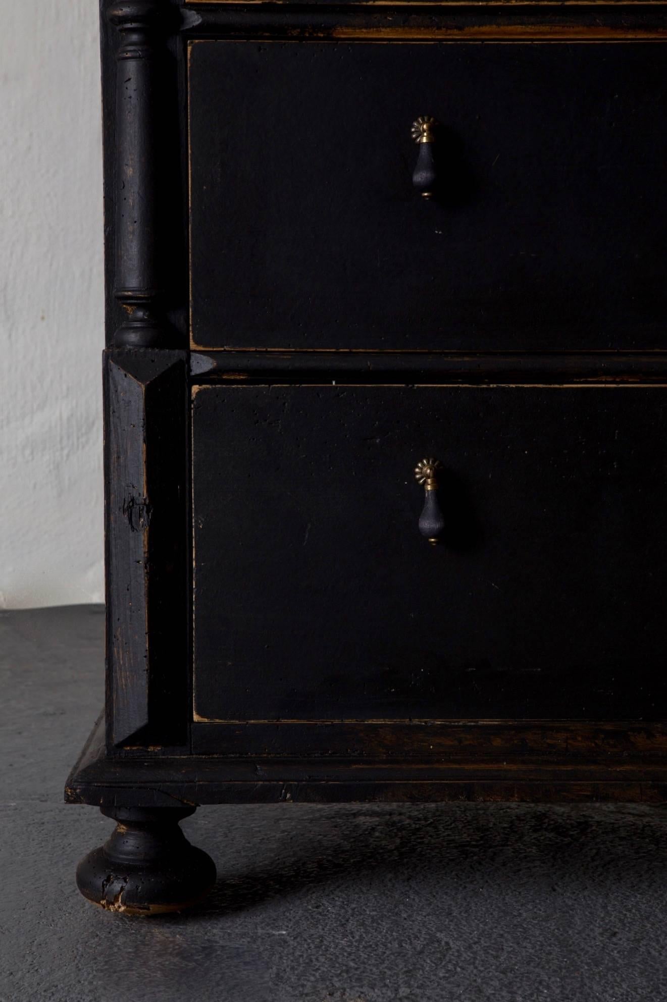A tall chest of drawers made during the late 19th century in Sweden. Painted in our signature color Laserow Black. Contemporary hardware. 

 