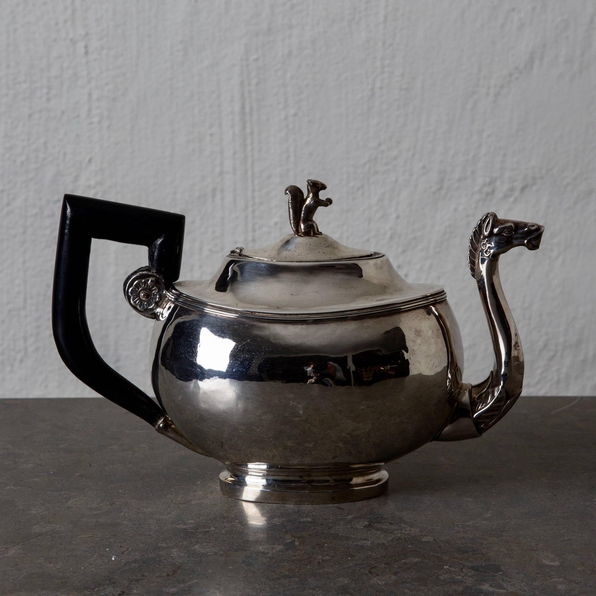 Coffee pot silver European 19th century blackened handle Austria. An exquisite example of a empire coffee pot made during the 19th century in Austria. Oval shape with beautiful details like a horse head and a squirrel. Stamped.