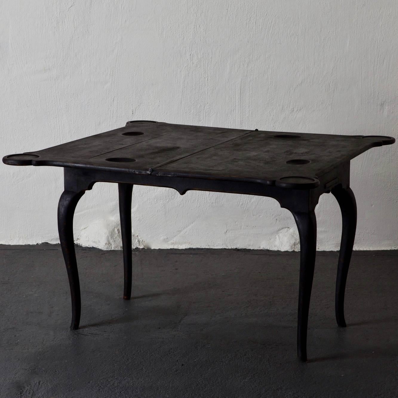 Table Game Swedish Black Rococo 18th Century Sweden. Game table made during the 18th century in Sweden. Cabriole legs. Top opens up to double size. Interior with backgammon and markers. Painted in our signature color Laserow Black. Open: 44