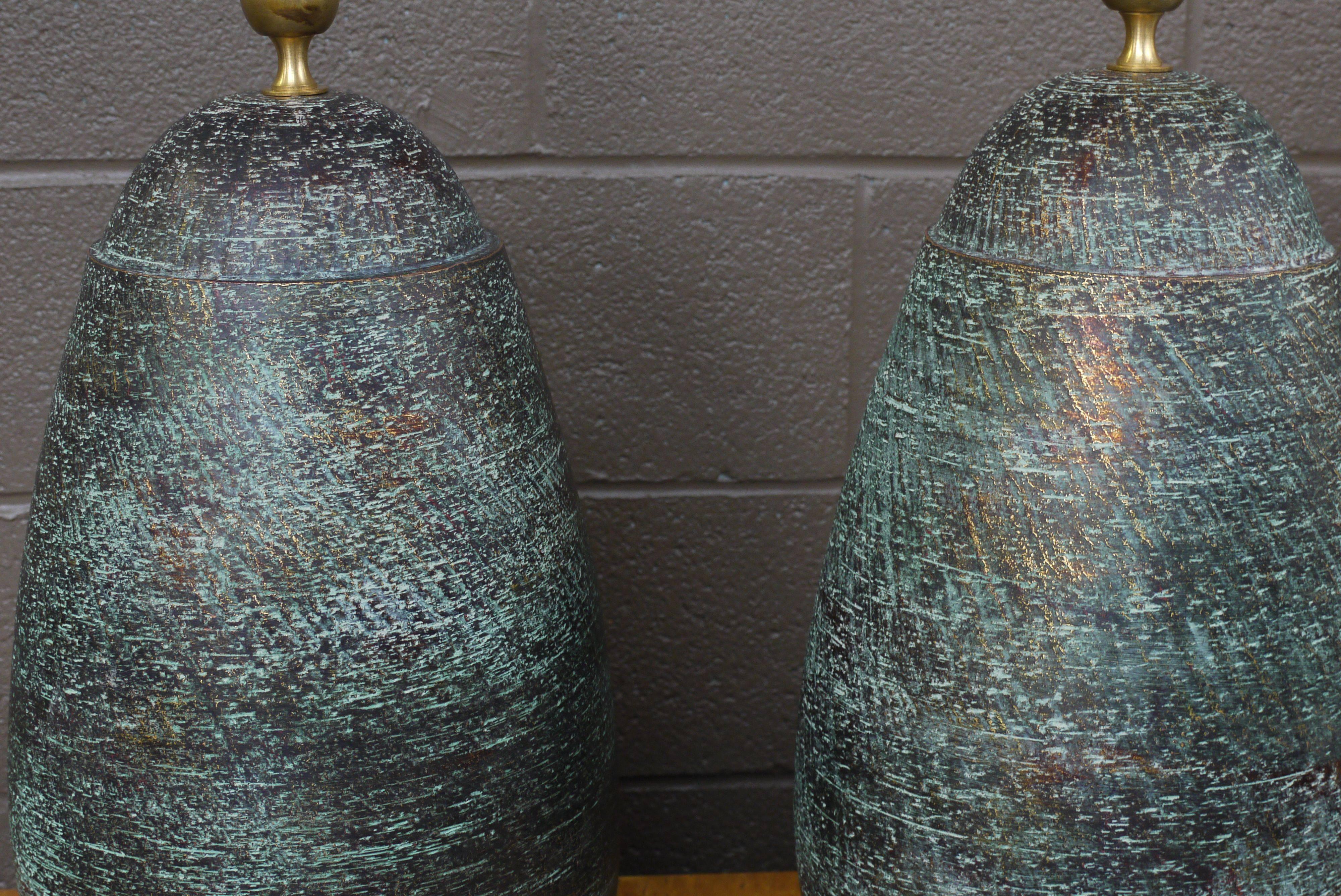 Stunning pair of Italian lamps attributed to Bitossi. Great vintage rubbed over the textured surface with hints of gold. Ceramic section measures 20