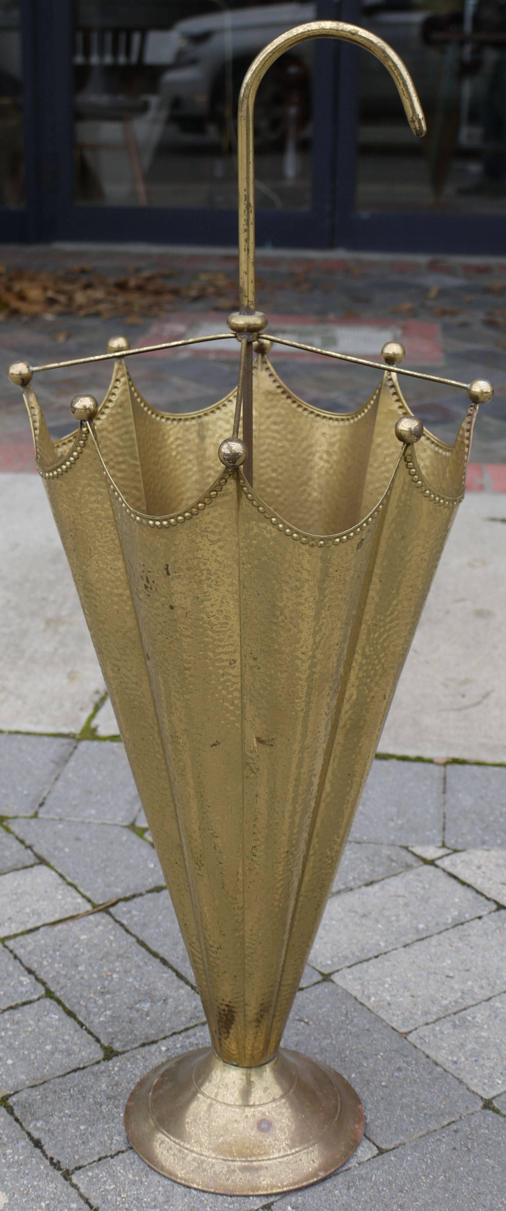 Whimsical brass umbrella shaped umbrella stand made in France in the 1940s, with hammered brass sides and a beaded edge.