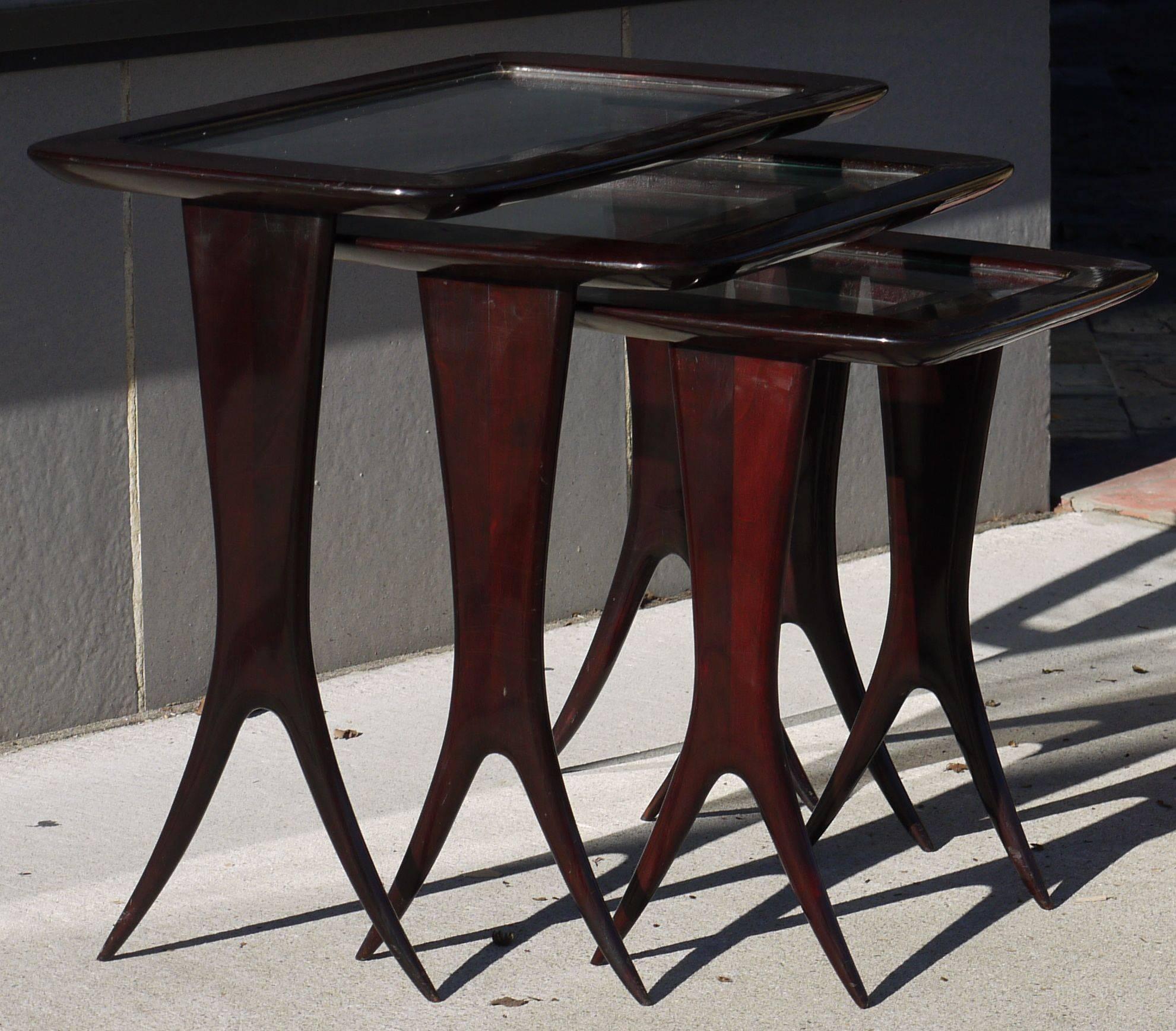 A documented set of elegant walnut nesting tables with glass tops by Raphael (1912-2000) Tables are in good original condition, marks, they have been polished and the finish is smooth,
France, circa 1950s.
Published: Ensembles Mobiliers Vol