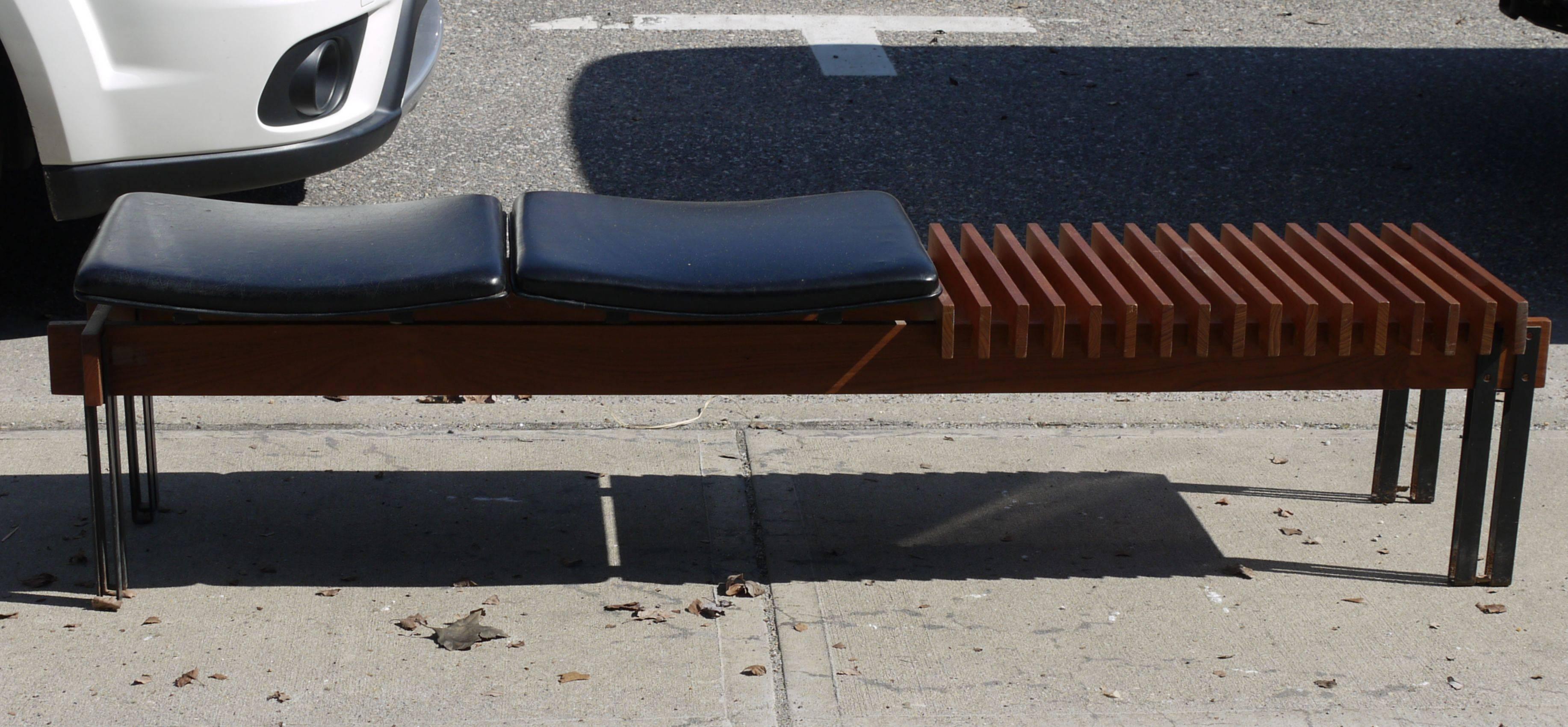 Mid-Century Modern bench constructed using teak on black metal legs with black leatherette seats. Iconic design from the 1960s.
 
Published in L'Arredamento Moderno, Settima Serie, Aloi, pg. 124.