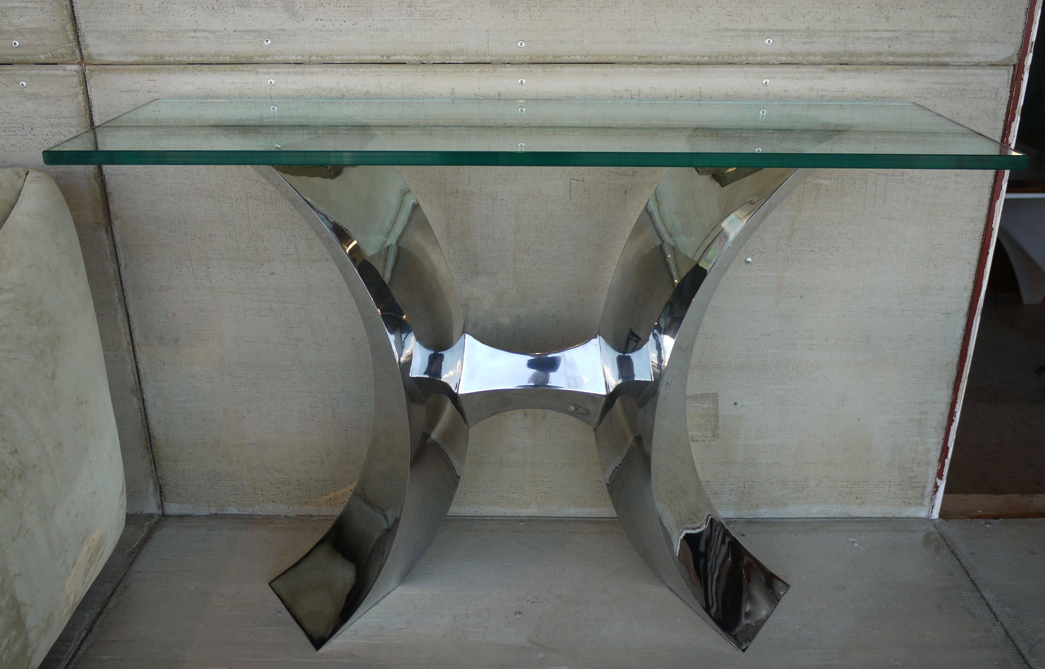 A one of a kind hand-forged stainless steel console by craftsman Curtis Norton featuring diamond shaped arches supporting a thick glass top. The console has been polished to a mirror like shine.