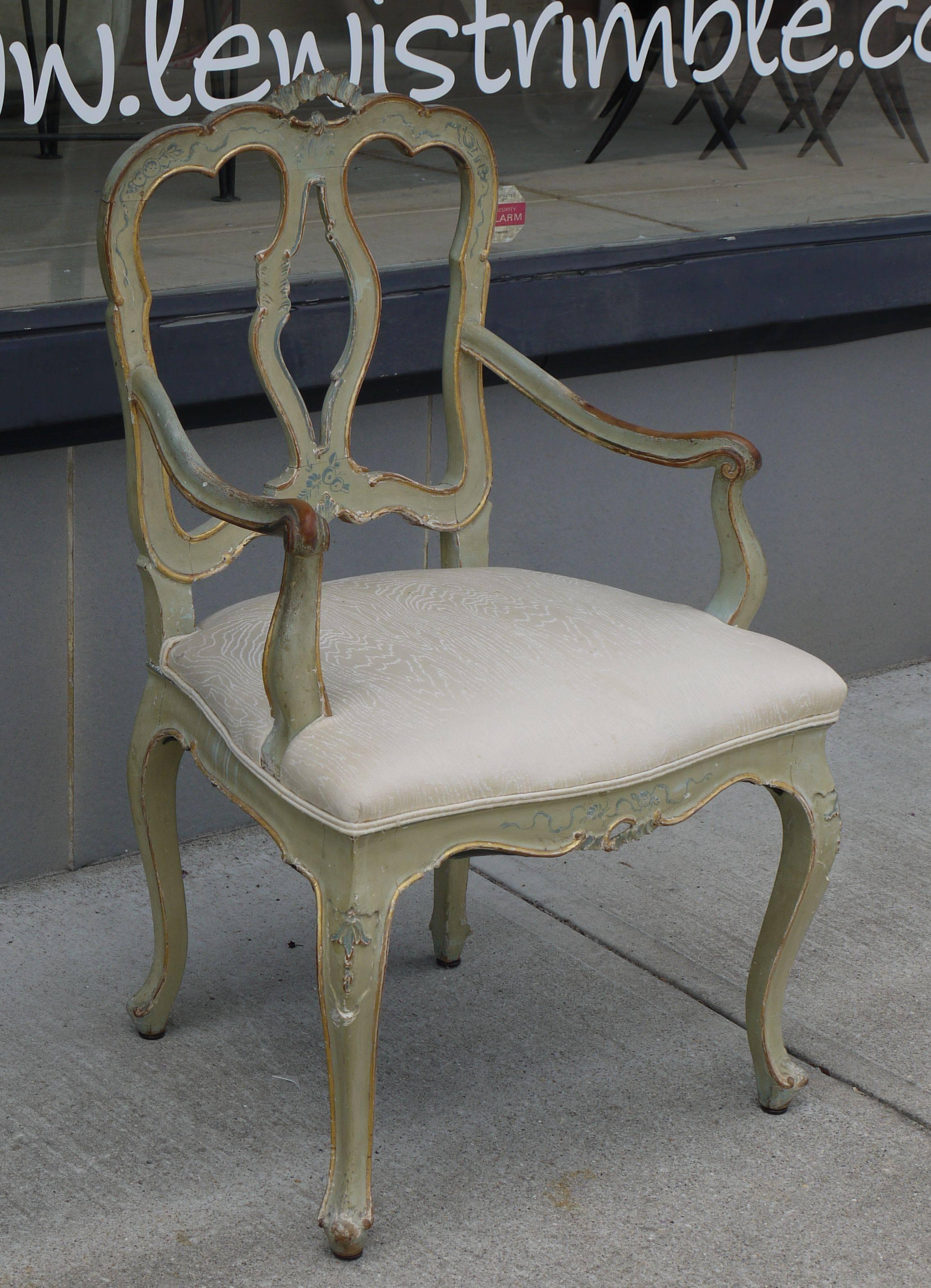 A stunning matched set of eight Venetian chairs dating to the mid-late 19th century. Wonderful oxidized paint and water gilt detailing to the chairs, with subtle brush work and a magnificent patina. The pale celadon color is just perfect. Most