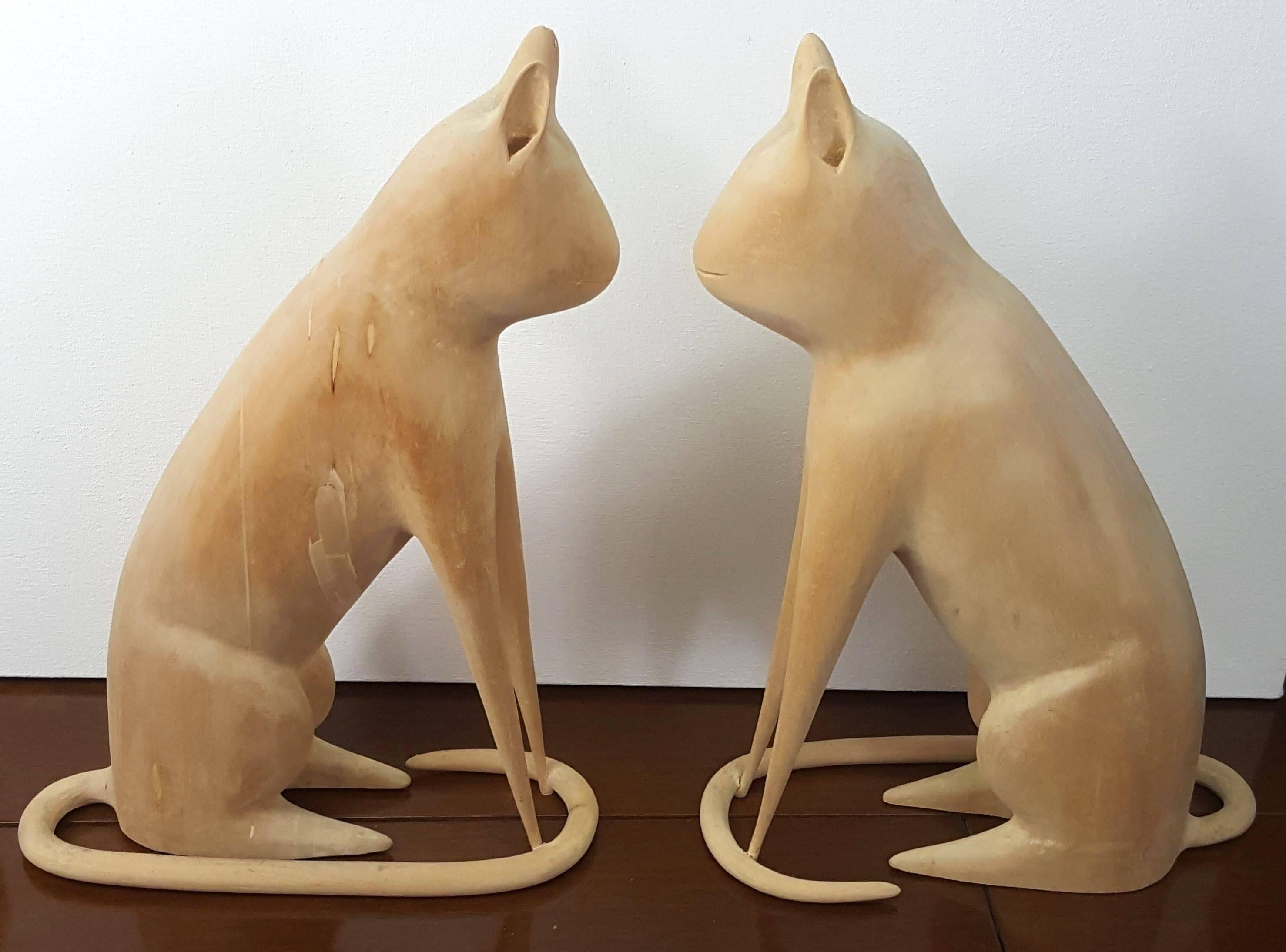 Linvel Barker was a retired metalworker turned folk artist. He didn't start carving until 1984 and he would rough out the shapes on a band saw and his wife would help him finish these. These particular cats were done in 1996 and a very similar cat