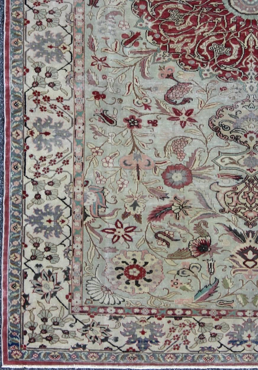 Fine Vintage Turkish Sivas Carpet with Floral Design in Light green Background.
Set on a pale mint green field, this finely woven sivas boasts a refined Classic design. The red medallion takes center stage and is surrounded by elegant palmettes,
