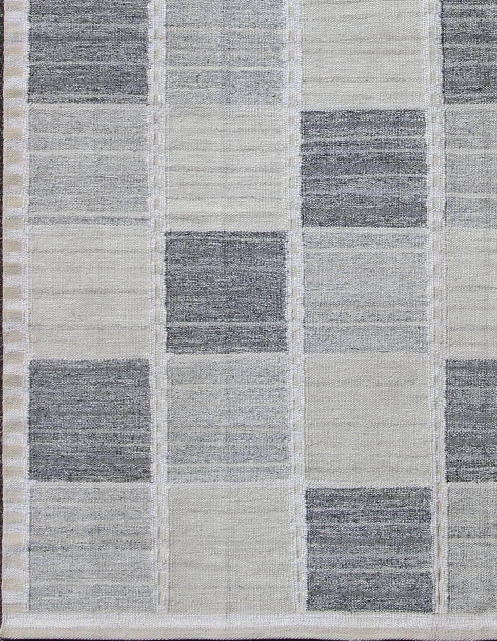 This Scandinavian flat-weave kilim is inspired by the work of Swedish textile designers of the early to mid-20th Century. Its dynamic and exciting composition is beautifully suited for contemporary interiors as well as classical interiors.  This