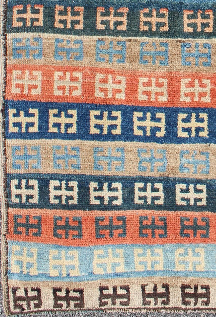 Vintage Turkish Tulu Rug with a Modern Striped  Design.
This vintage Tulu rug is handwoven from wool in a dynamic cobalt, light blue, orange, tan, dark green, and espresso palette. Tulu carpets' unique colors and bold geometric patterns transform