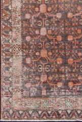 Antique Khotan Rug with Repeating Medallions in Burnt Orange and Deep Brown