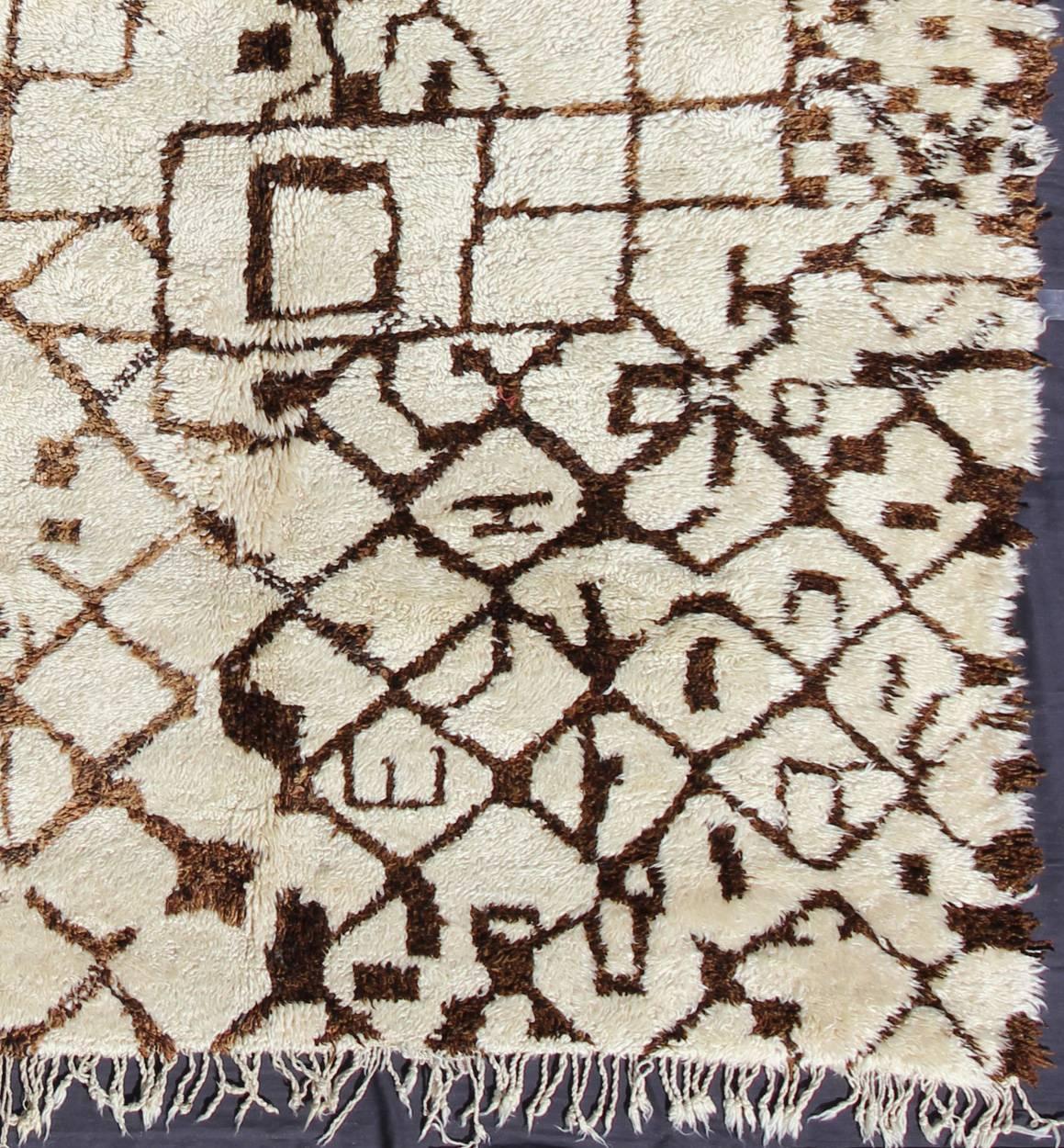 Measures: 7'5'' x 13'7''.
This fabulously complex and interesting carpet features principally lozenge-based designs with a lattice flanked by checkered and diamond shapes filled in with lozenges with extended sides (The lozenge is a classical female