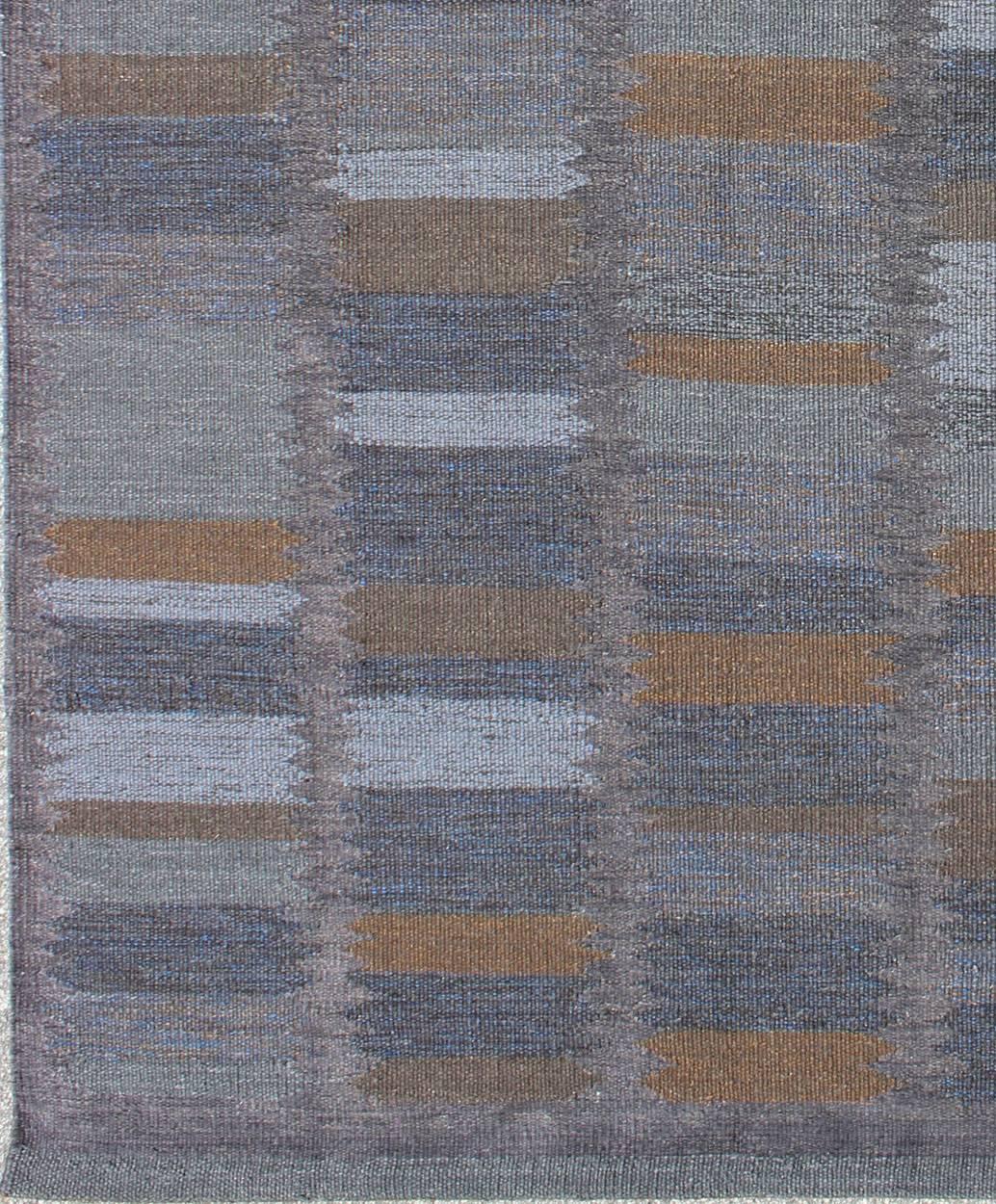 This Scandinavian Flat-Weave patterned rug is inspired by the work of Swedish textile designers of the early to mid-20th Century. With a unique blend of historical and modern design, this dynamic and exciting composition is beautifully suited for