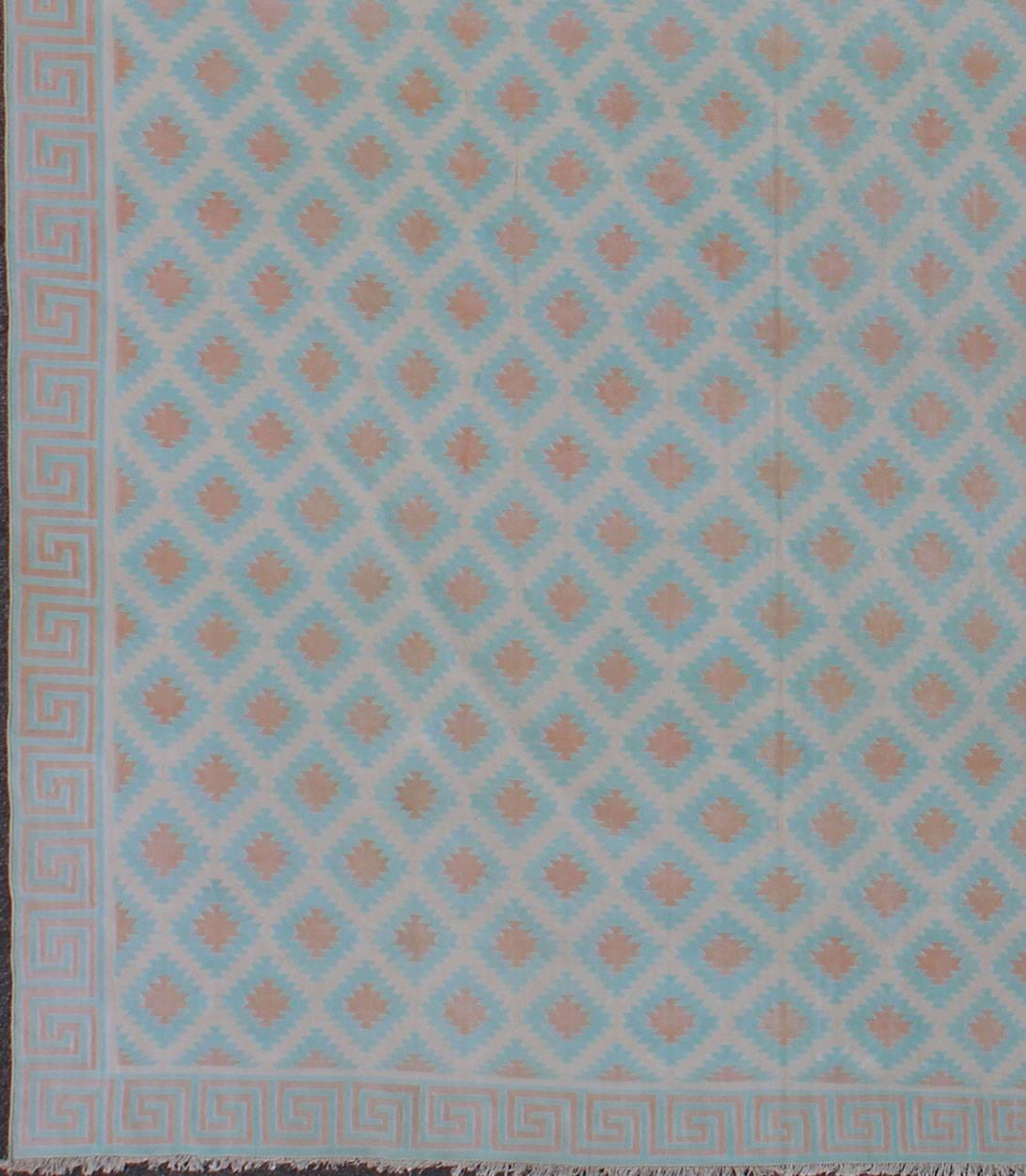 
Large Vintage Decorative Indian Cotton Dhurrie, Collection of Thomas Britt
Woven during the mid-20th century, this designer cotton dhurrie is decorated with a stepped diamond pattern rendered with an inventive low-contrast color palette. This