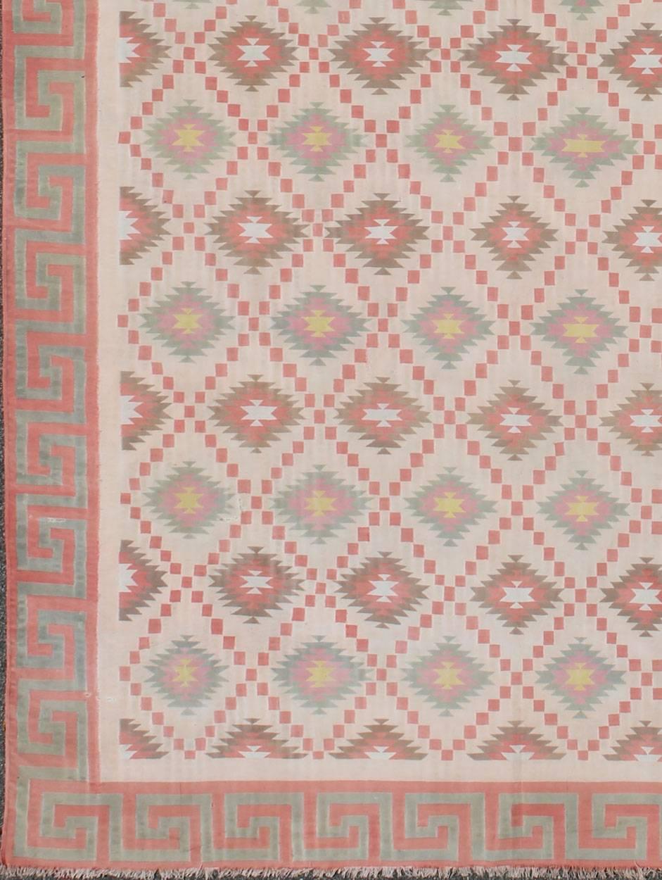 Large Vintage Indian Designer Cotton Dhurrie.
Woven during the mid-20th Century, this designer flat-woven Indian cotton dhurrie is decorated with a stepped diamond pattern and features an inventive low-contrast color palette. A Greek key border