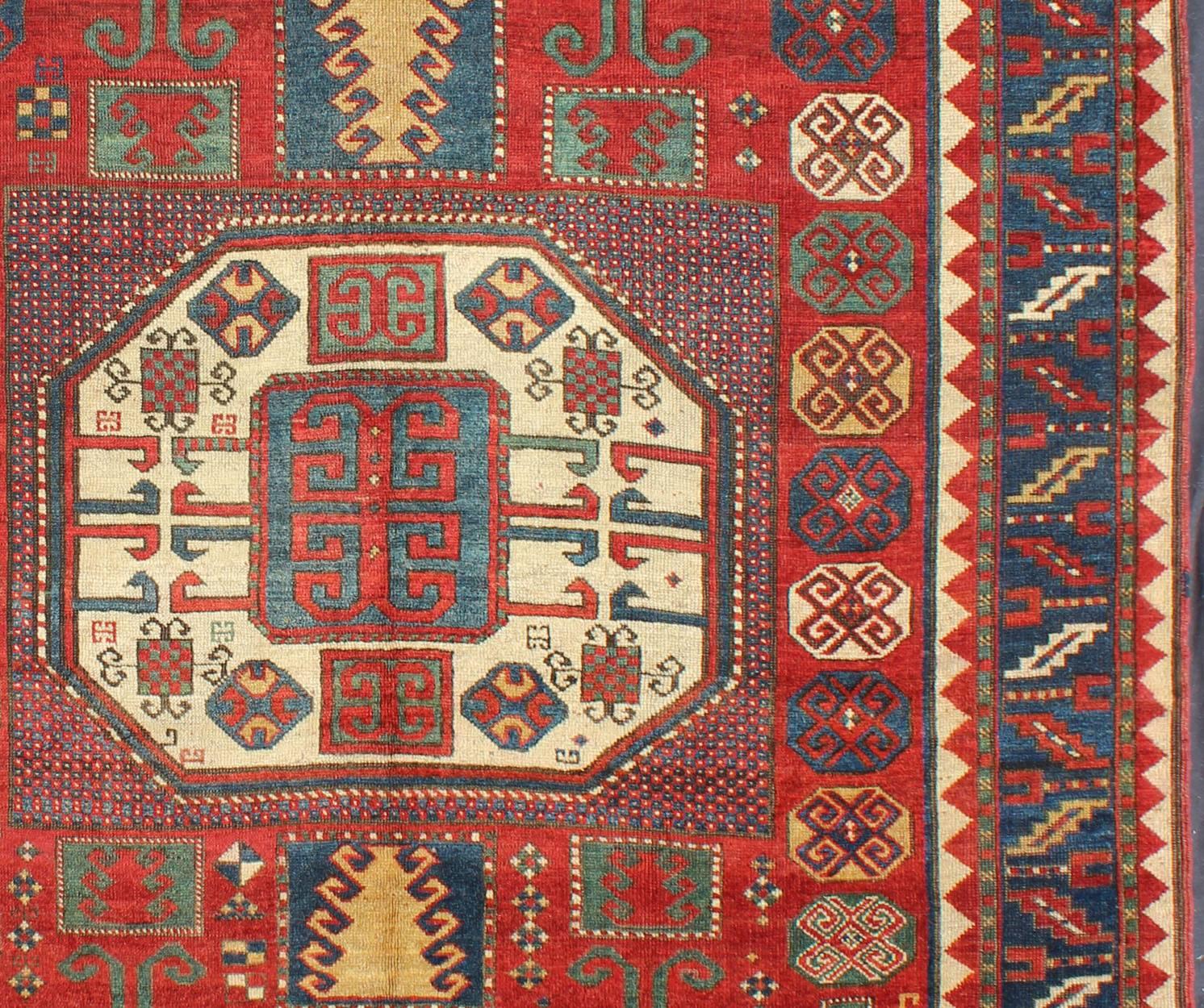 Caucasian Antique Kazak Karachopf Rug with Octagon Medallion in Red, Blue and Green Tones For Sale