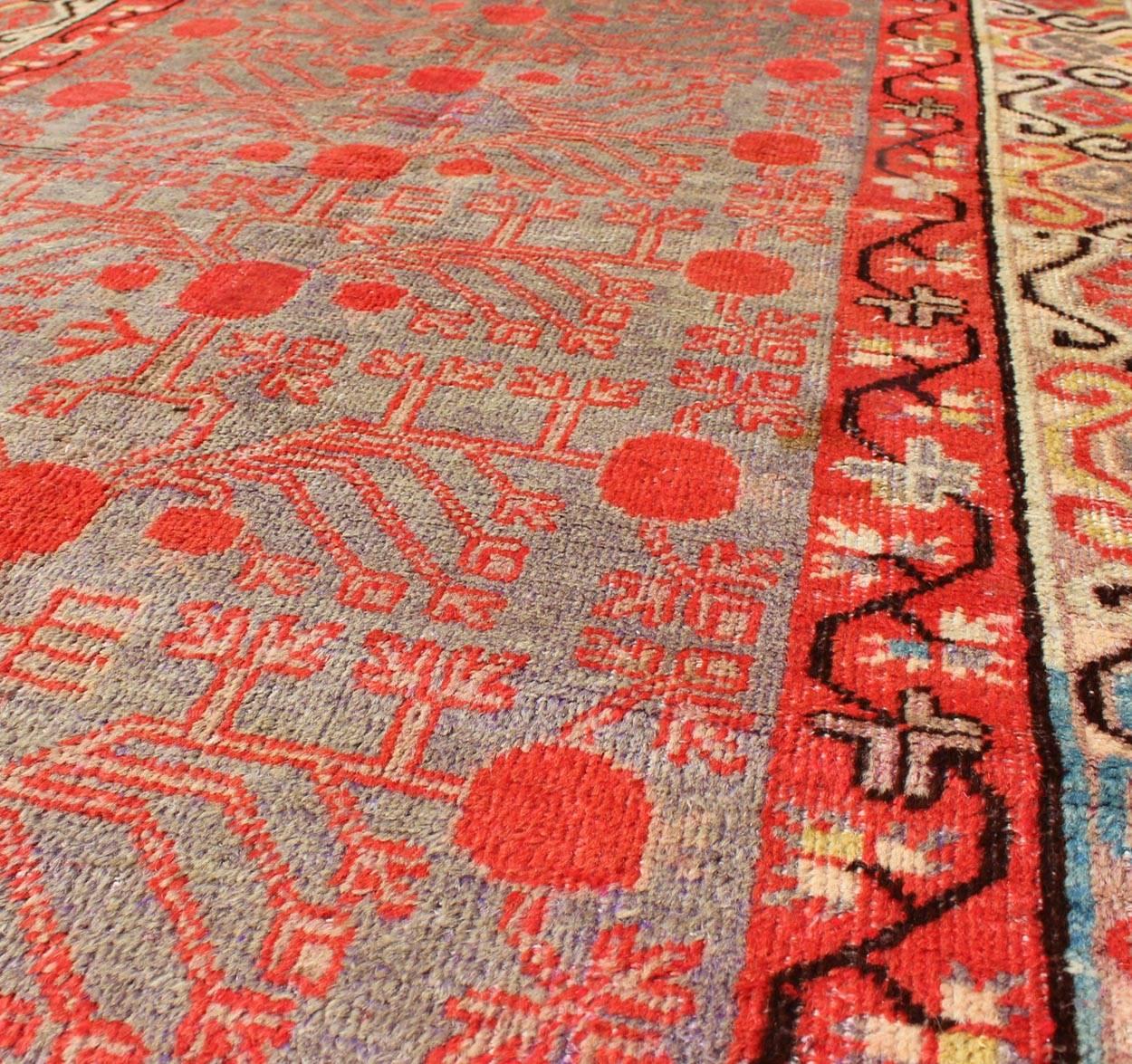 Intricate Vintage Khotan Rug with Sub-Geometric Design in Reds and Light Blue In Good Condition For Sale In Atlanta, GA