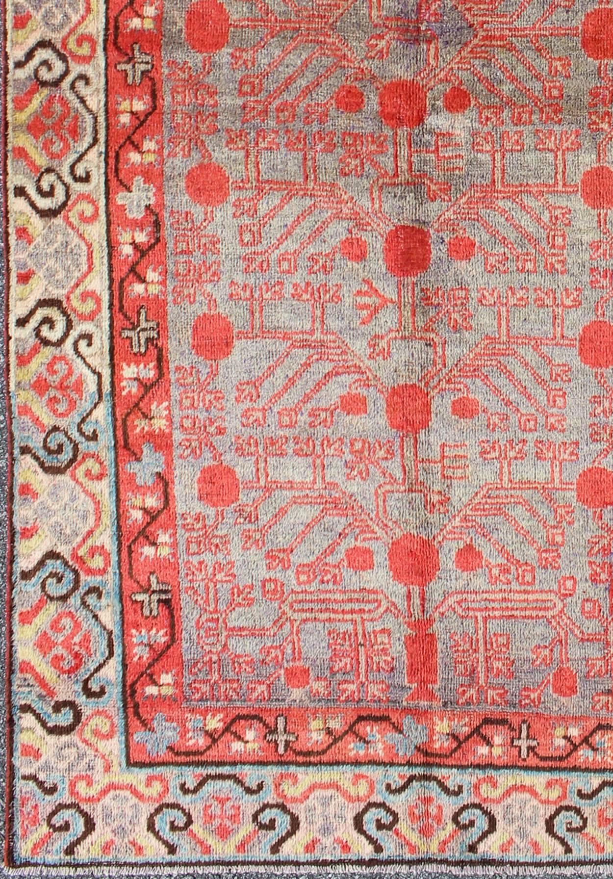 Measures: 3'10'' x 8'1''.
This unique antique Khotan rug is a spectacular testament to the complexity of Turkestan design. The red and light blue of the central field plays host to a stunning sub-geometric pattern design enclosed within a double