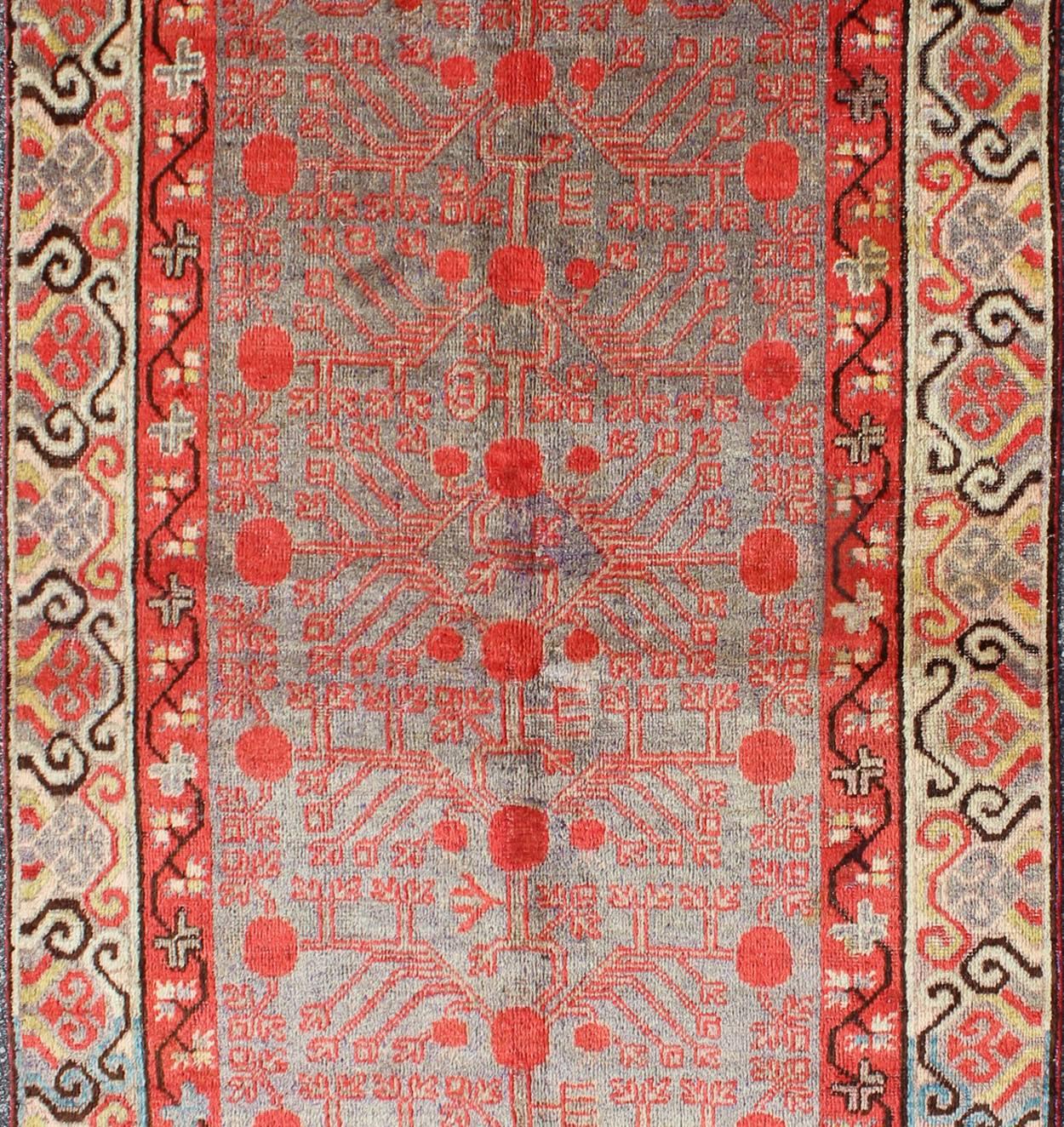 East Turkestani Intricate Vintage Khotan Rug with Sub-Geometric Design in Reds and Light Blue For Sale