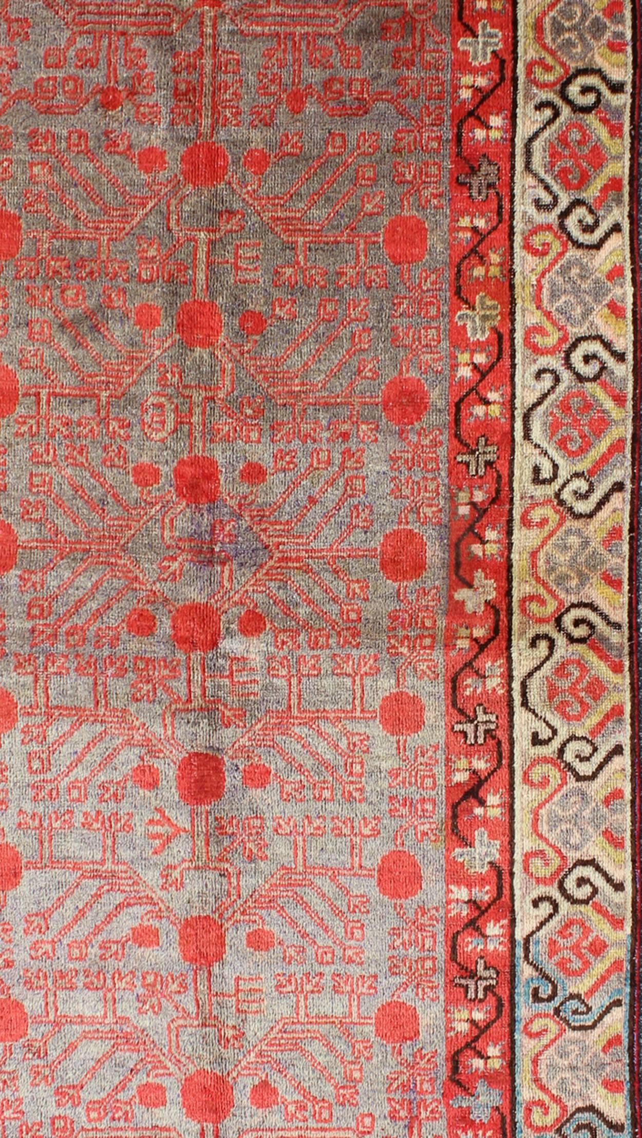 Hand-Knotted Intricate Vintage Khotan Rug with Sub-Geometric Design in Reds and Light Blue For Sale