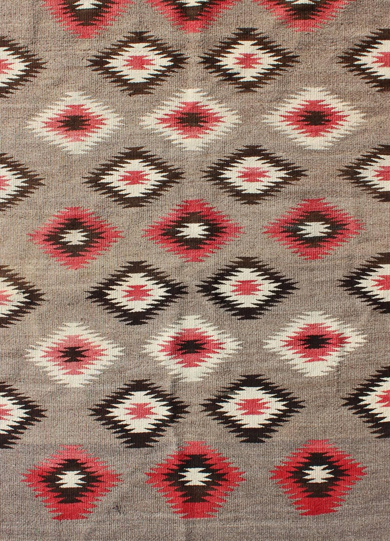 Hand-Woven American Navajo Rug with Geometric All-Over Design in Reds and Browns For Sale