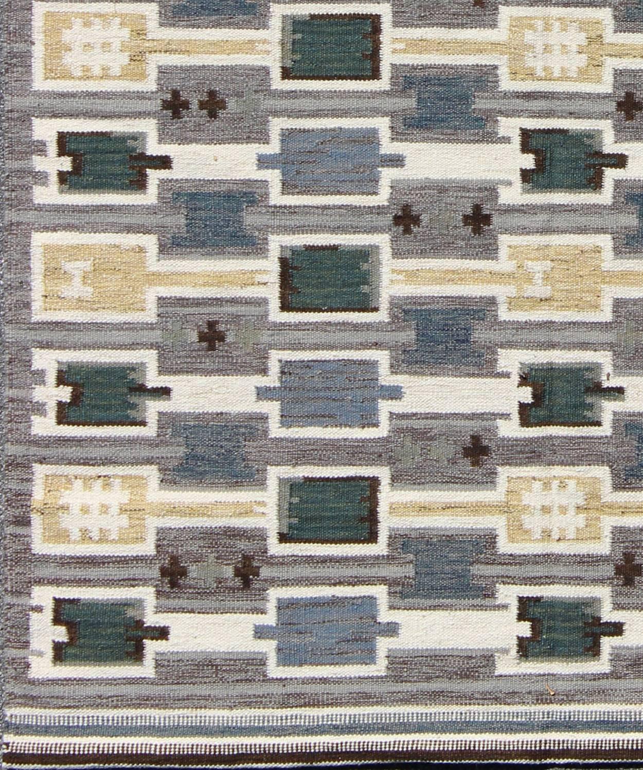 This Scandinavian flat-weave rug is inspired by the work of Swedish textile designers of the early to mid-20th century. With a unique blend of historical and modern design, this dynamic and exciting composition is beautifully suited for contemporary