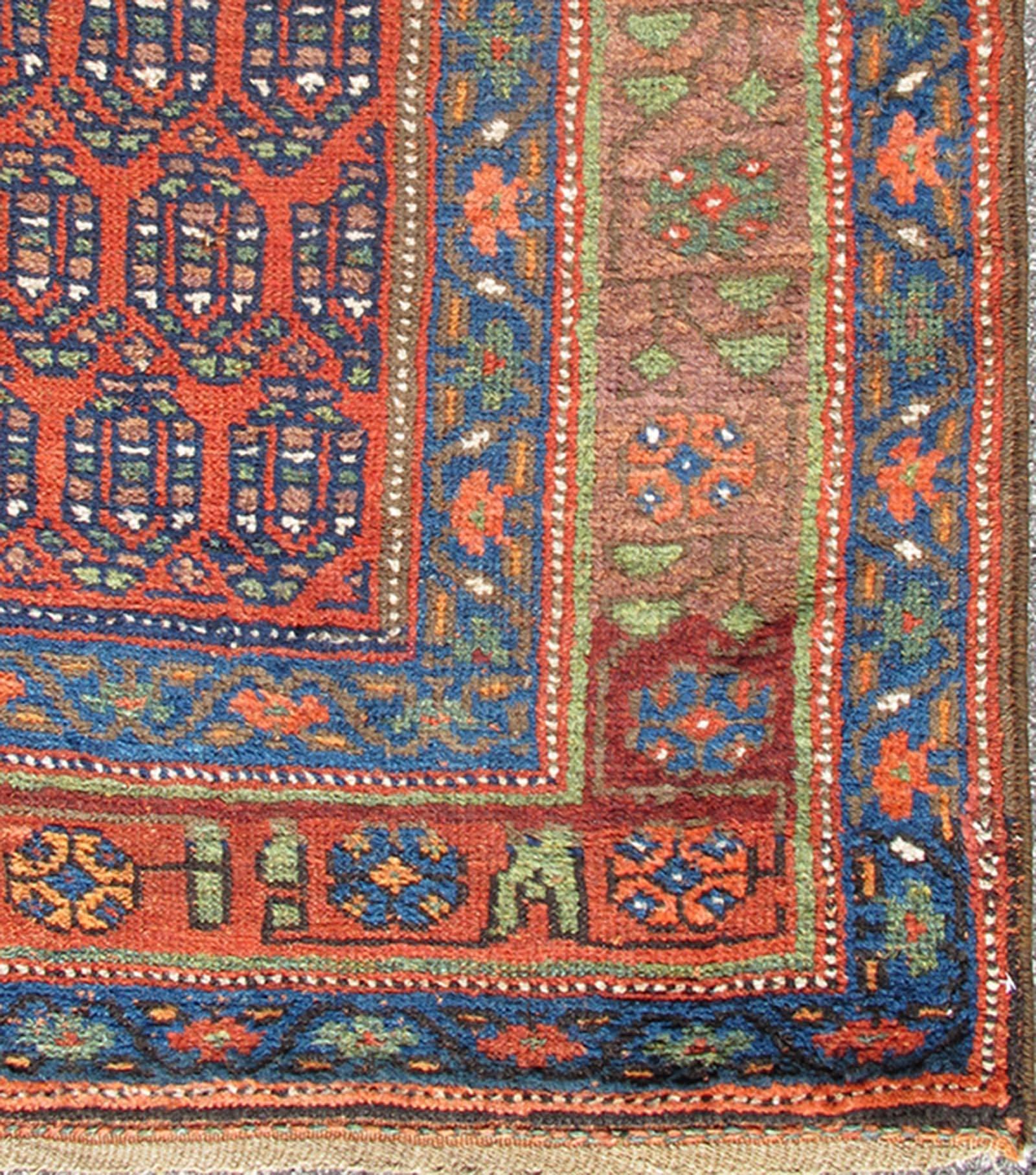Long Persian Bidjar Kurdish Runner with small Paisley Design in Red, Blue, Brown, 13-1108, Great Northwest Persian Bidjar Kurd runners are renowned for their superior use of color. This charming rug uses a full spectrum of vegetable dyes ranging