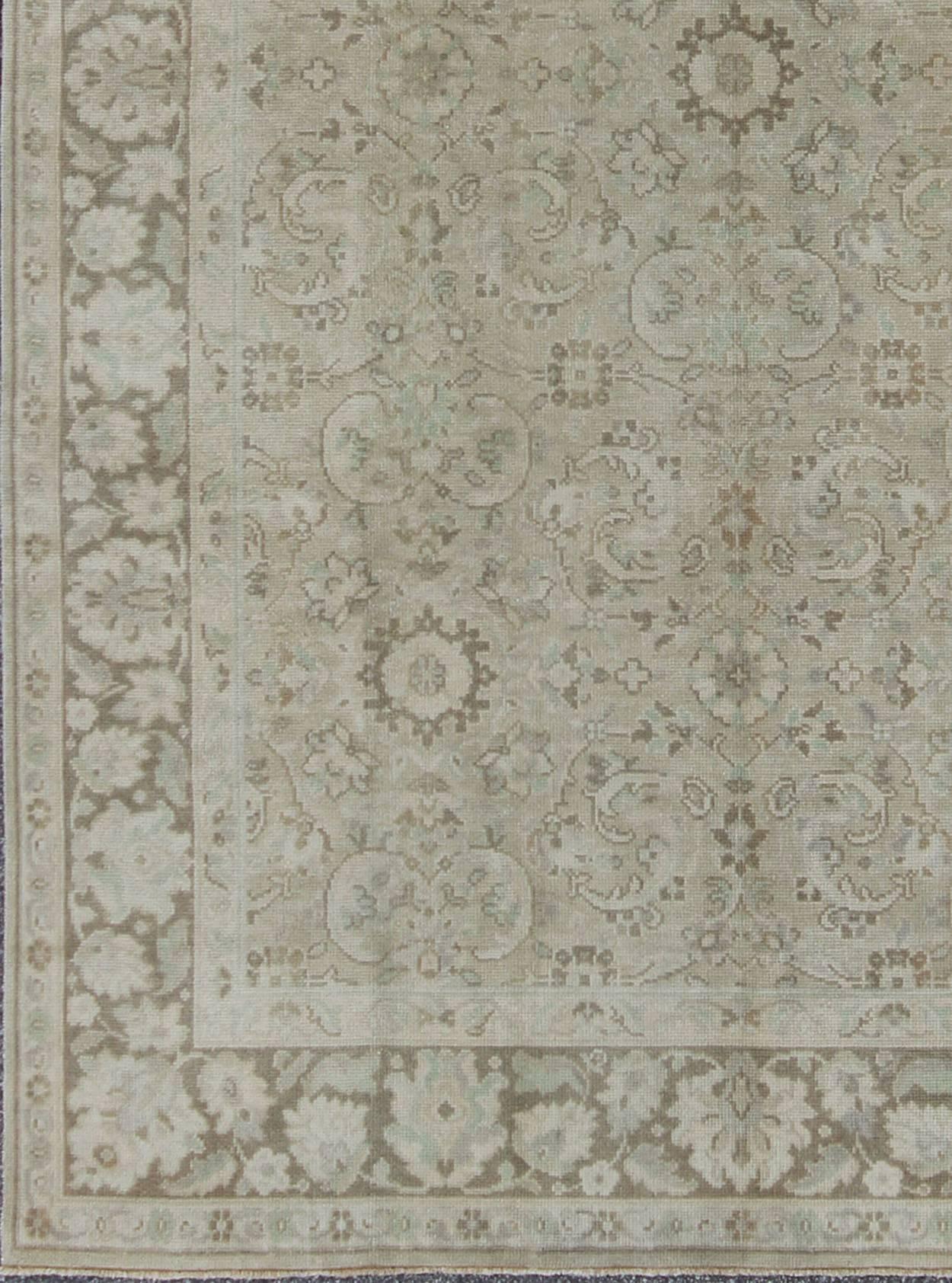 Vintage Earth Tone Oushak Rug in Sand and Taupe background with All-Over Design, Tu-Vey-4610, kwarugs. This Turkish Oushak rug features a sand-colored field and a delicate trellis design of scrolling vinery and scattered fleuron. An over-arching and
