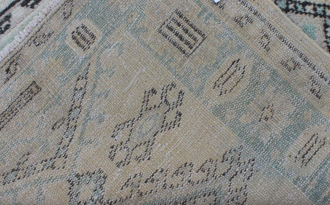 20th Century Vintage Oushak Runner with Ornate Medallions and Light Blue Tones