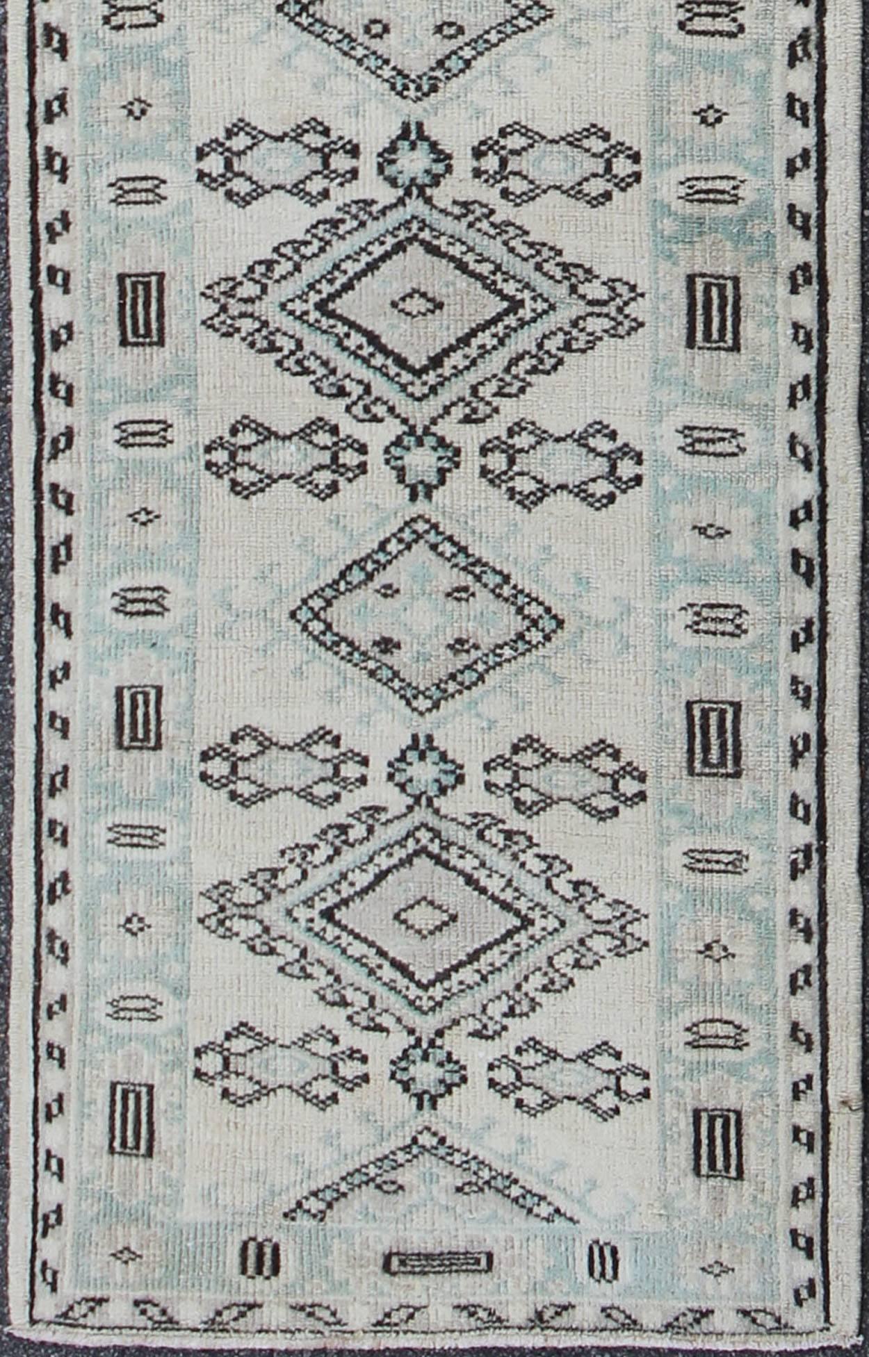 This compelling and unique Oushak runner was made in the mid-20th century in Turkey. Characterized by a comely and highly representative Oushak composition, this carpet beautifully showcases the finer points of Oushak weaving. This vintage runner
