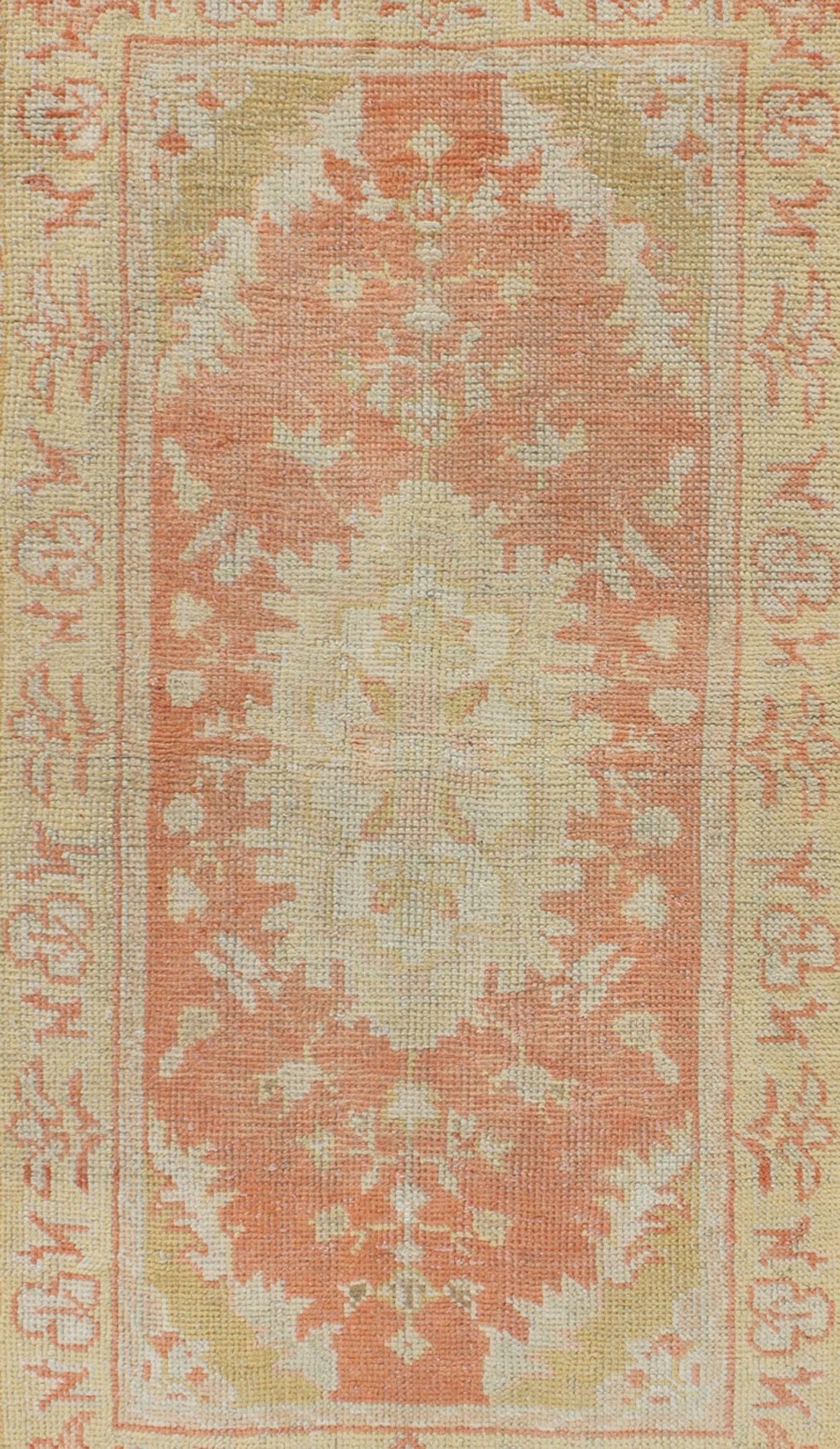 Hand-Knotted Antique Turkish Oushak Rug with Floral Motifs and Coral Background For Sale