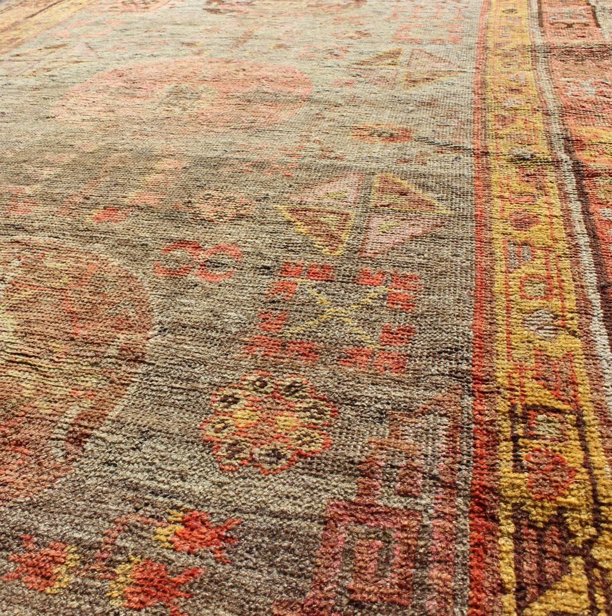 20th Century Central Asia Antique Khotan Rug with Floral Geometrics For Sale