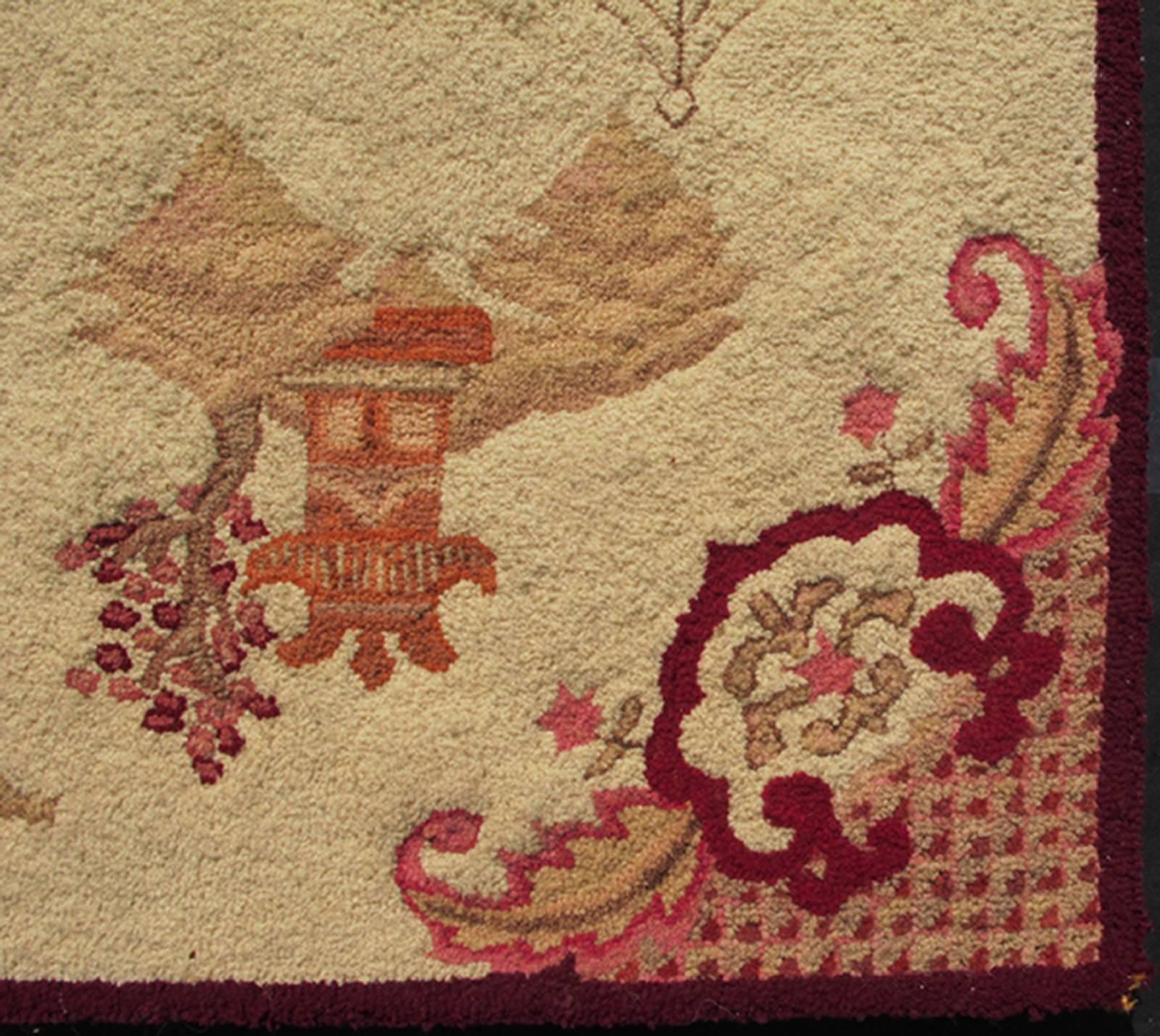 This beautiful vintage American hooked rug displays a zen scenery with various red colors and cream. This rug is mounted on a board ad ready to be mounted or framed.
Measures: 2'6 x 3'10.