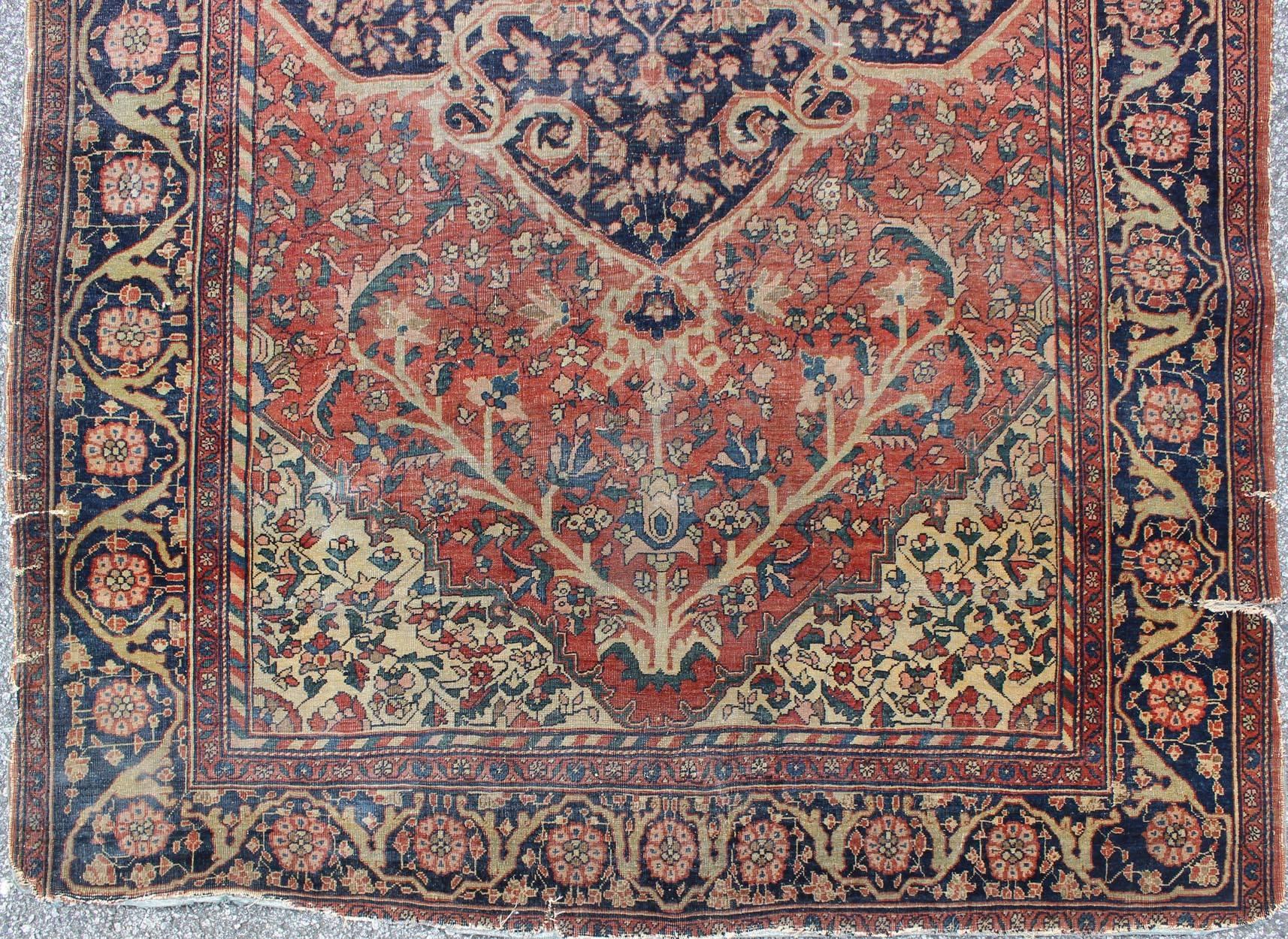 Antique Sarouk Faraghan Persian Rug with Florals in Navy, Red and Cream In Fair Condition In Atlanta, GA