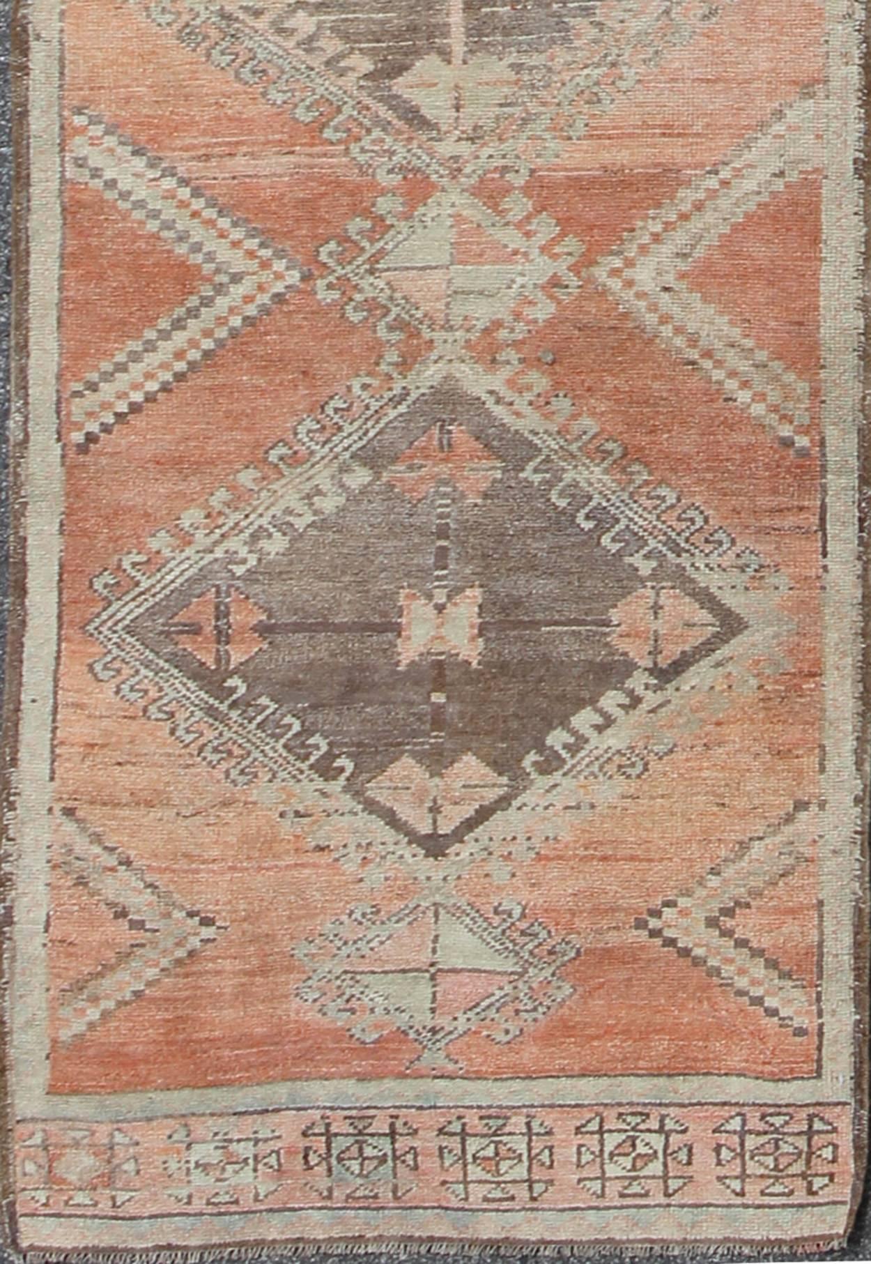  Runner with Multi-Medallions and Tribal Motifs in Brown and Red

This Turkish Oushak runner features a multi-medallion design as well as patterns of smaller tribal motifs. Colors include dark brown, muted red, and cream. Turkish Oushaks are notable
