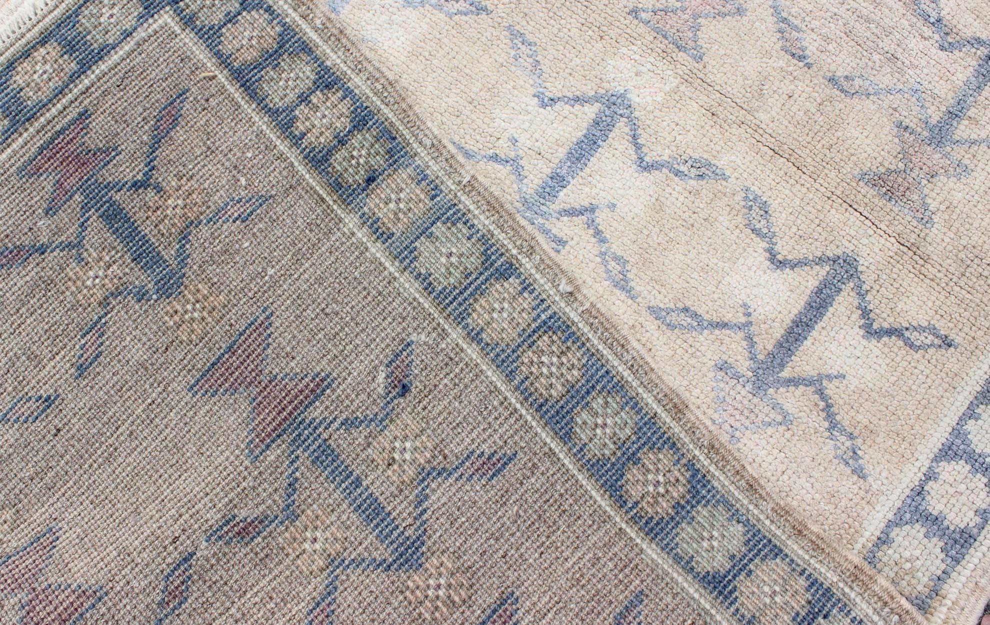 20th Century Small Turkish Tulu Carpet with Blue Tribal Motifs in a Sand-Colored Field