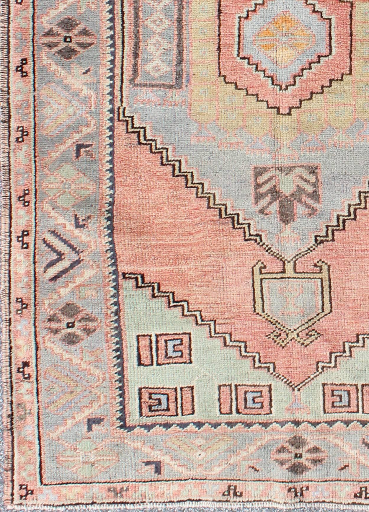 Vintage Turkish Oushak Medallion Rug in Salmon, Light Green, Gray & Light Blue  

Measures: 3'2 x 6'3.

Turkish Tribal Vintage Oushak with Medallion. Keivan Woven Arts, rug/EN-142854,  origin/turkey, vintage Oushak.   

This beautiful rug features a