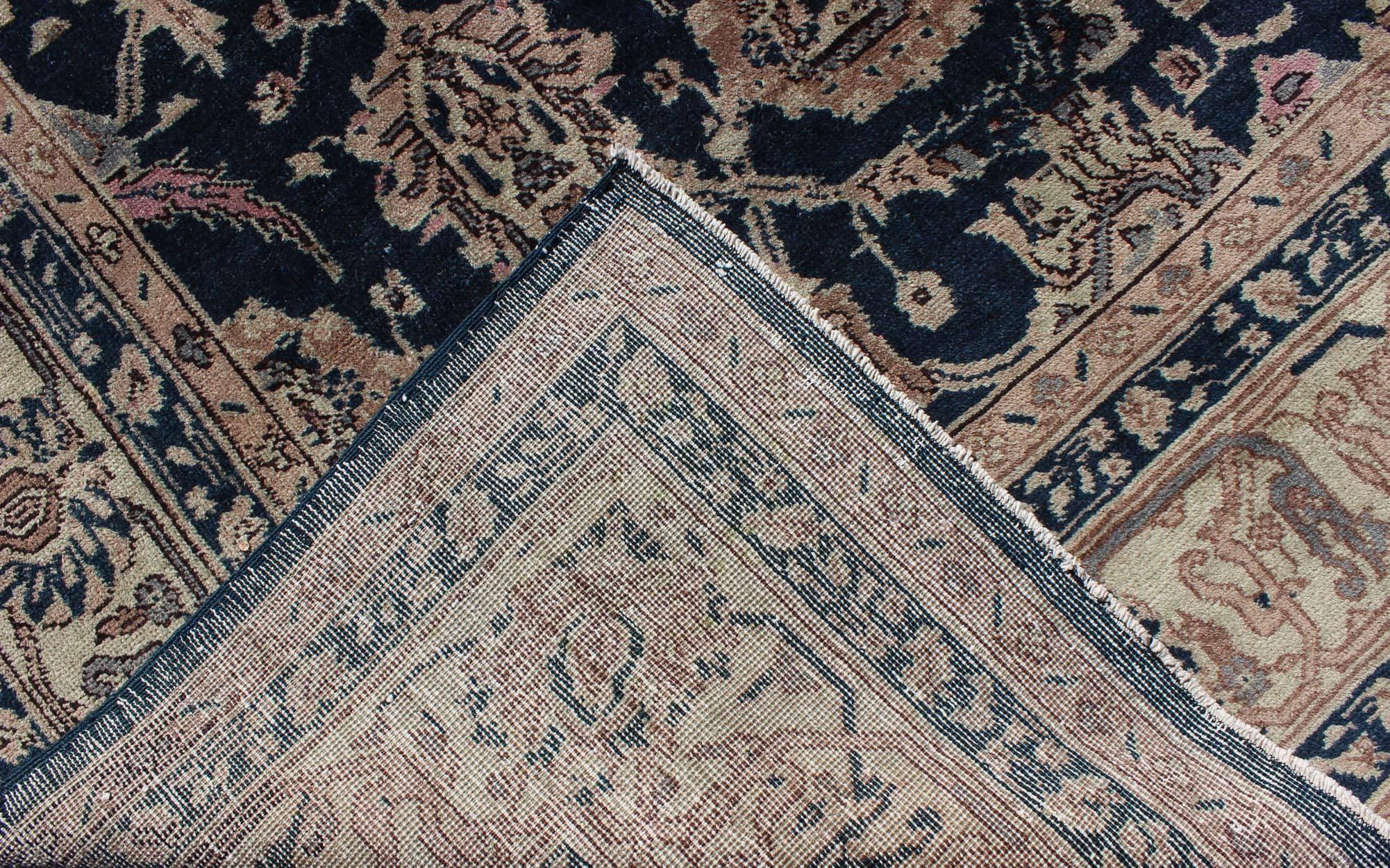 Hand-Knotted Turkish Vintage Carpet with Deep Navy Background and Lovely Botanical Motifs For Sale